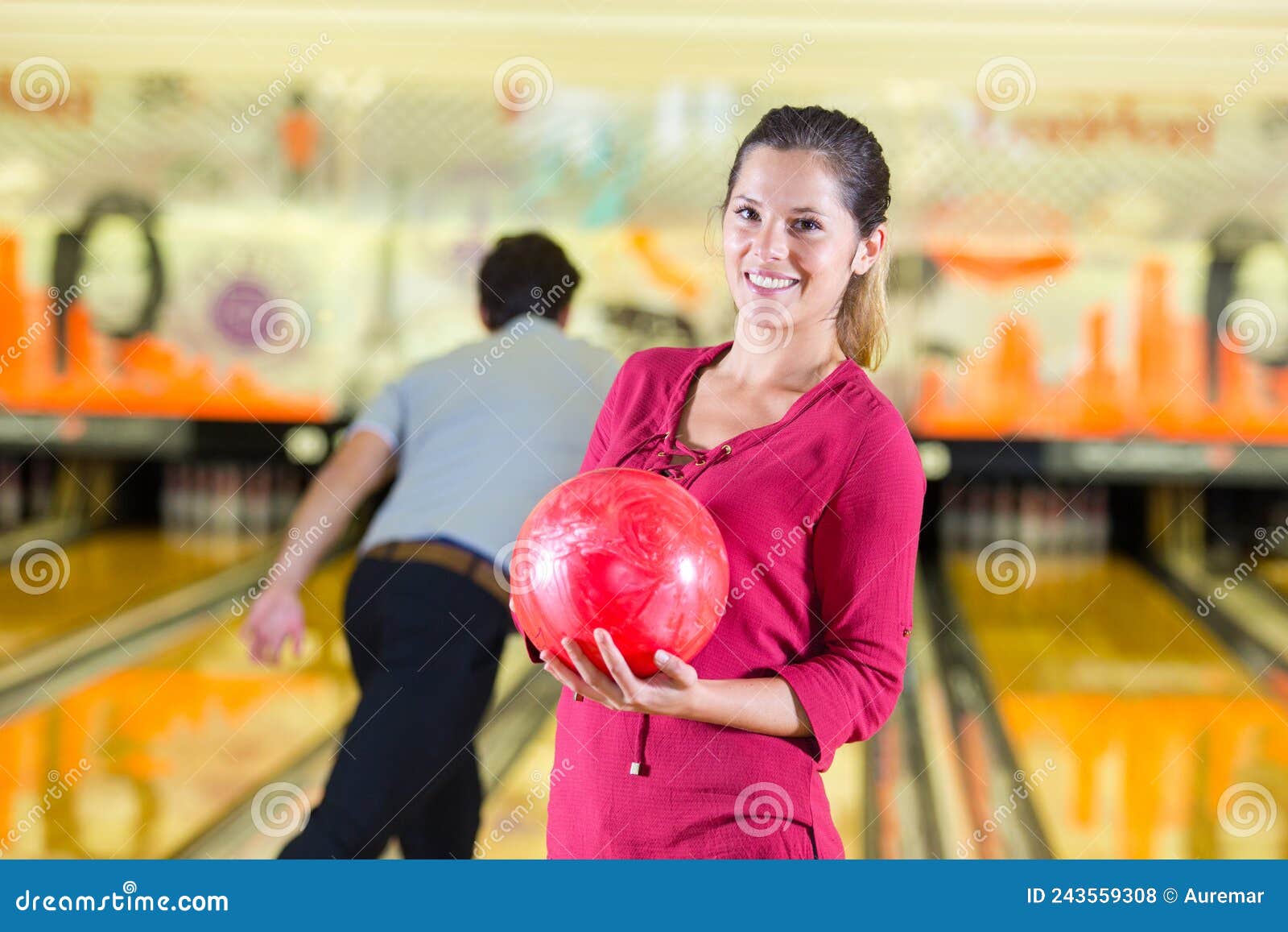 Posing on bowling lane stock photo. Image of holding 243559308