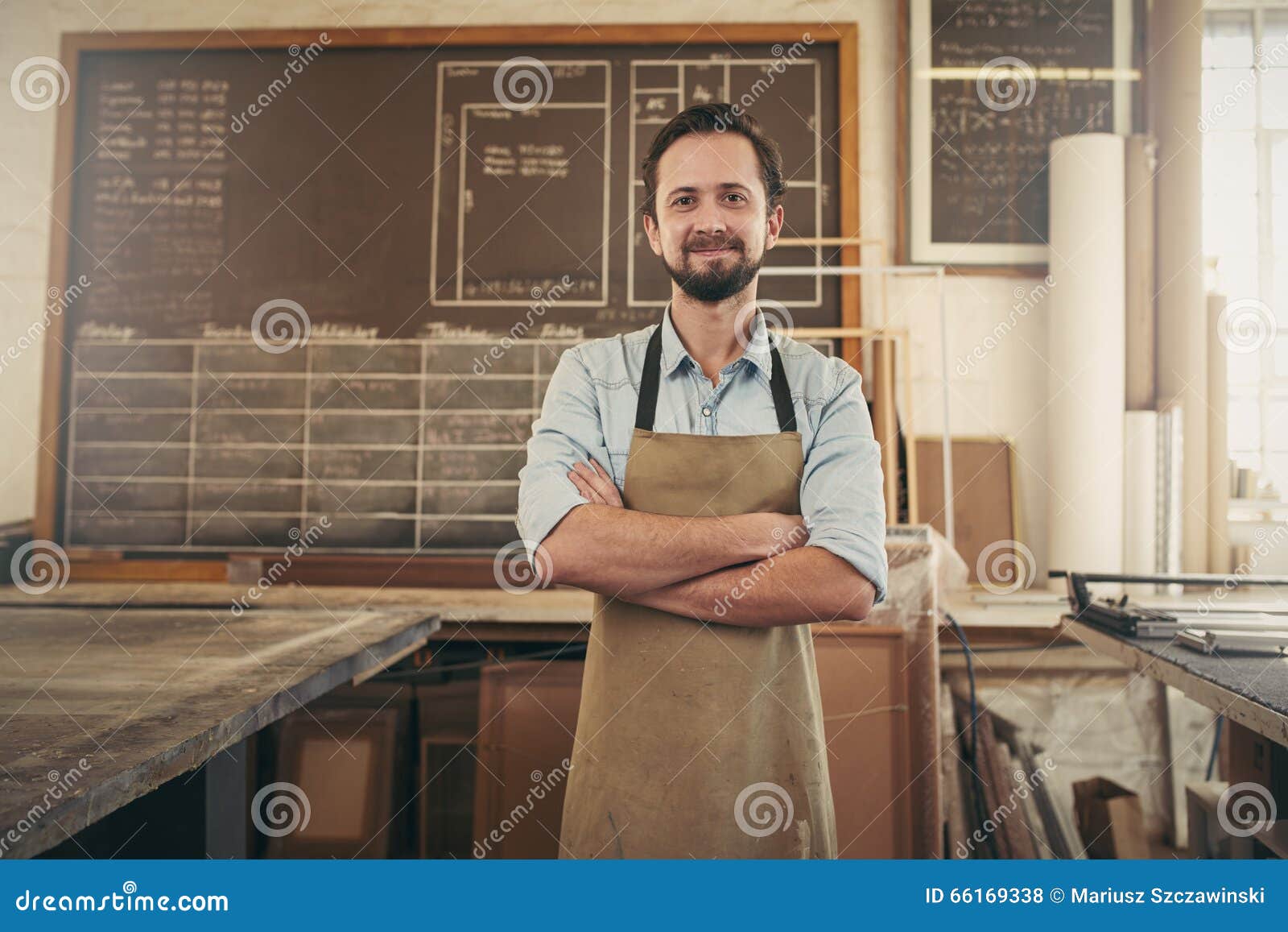 Positive Craftsman in His Workshop with Arms Folded Stock Photo - Image