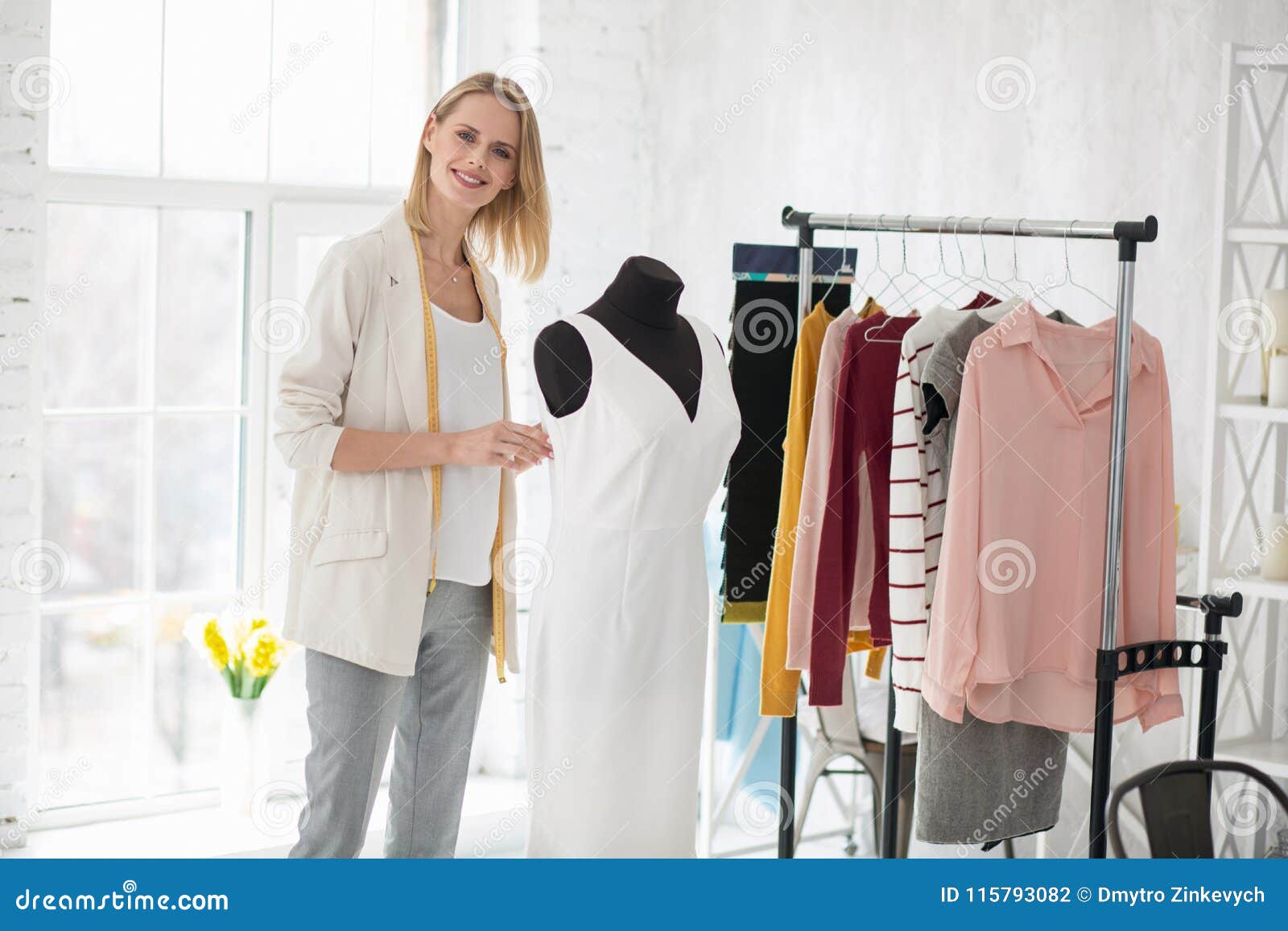 Positive Female Dressmaker Working on Dress Stock Photo - Image of ...