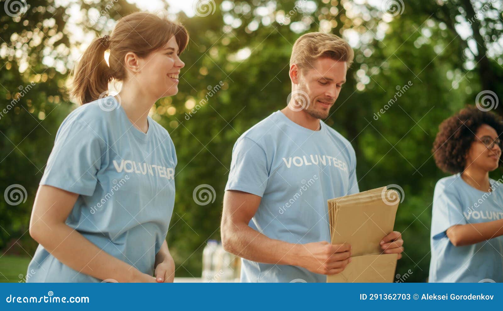 Positive Group of Volunteers Preparing Humanitarian Aid and Donations