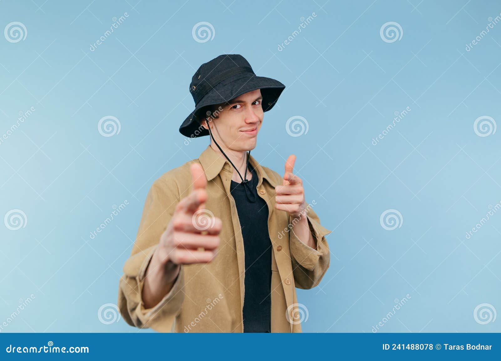 Positive Guy in Shirt and Panama Pointing Fingers at Camera and Smiling