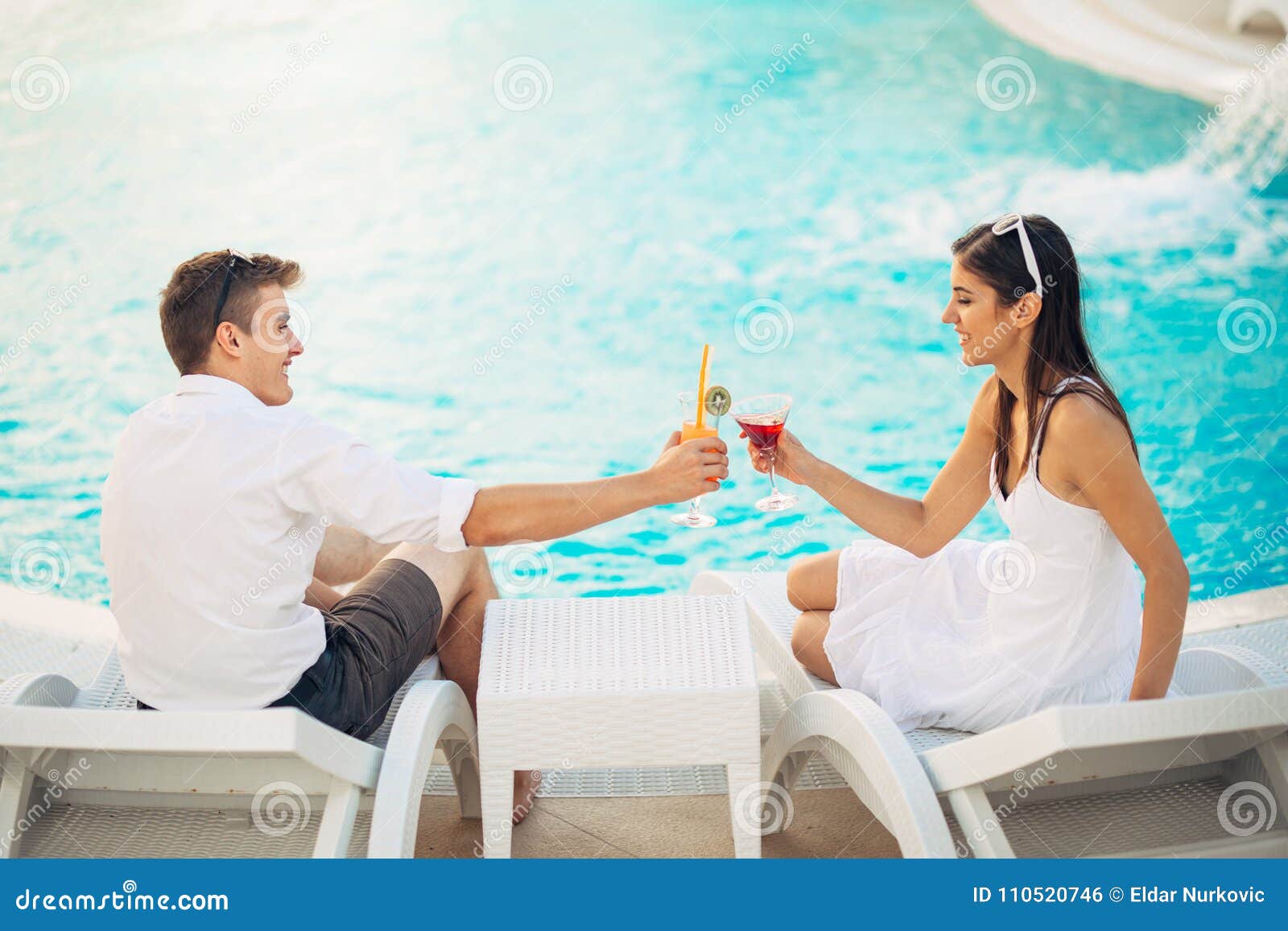 Positive Happy Couple Having a Romantic Afternoon by the Pool in