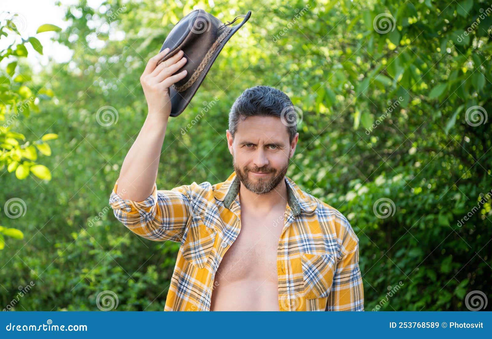 Positive Macho Man in Cowboy Hat. Macho Man in Checkered Shirt Stock ...