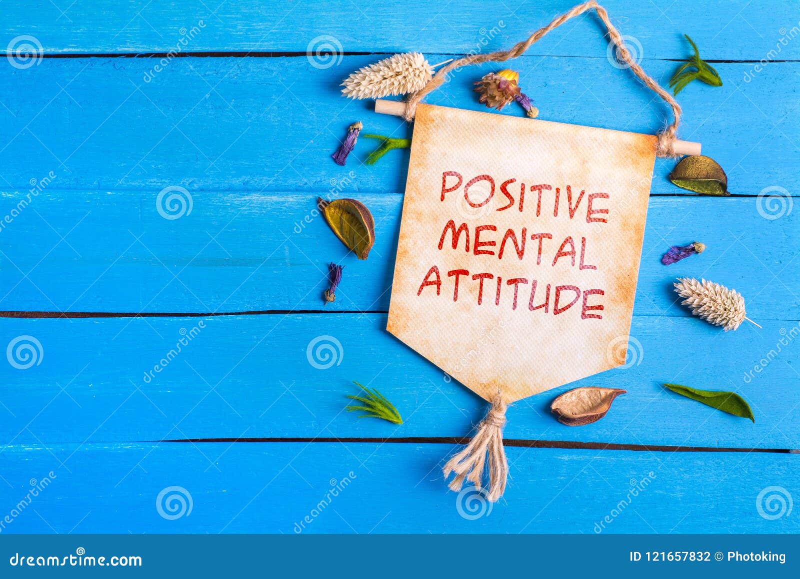 positive mental attitude text on paper scroll