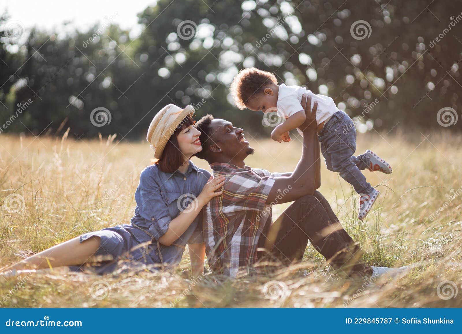 Positive Multi Generation Asian Family Posing And Smiling At Camera ...