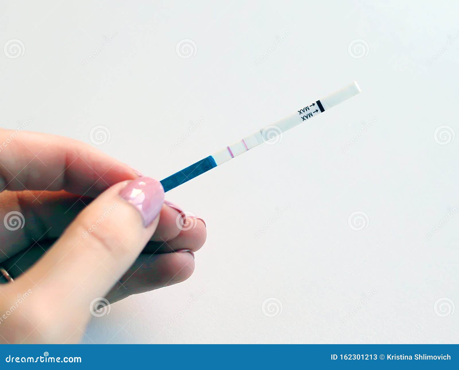 Positive Pregnancy Test in a Woman`s Hand Stock Image - Image of