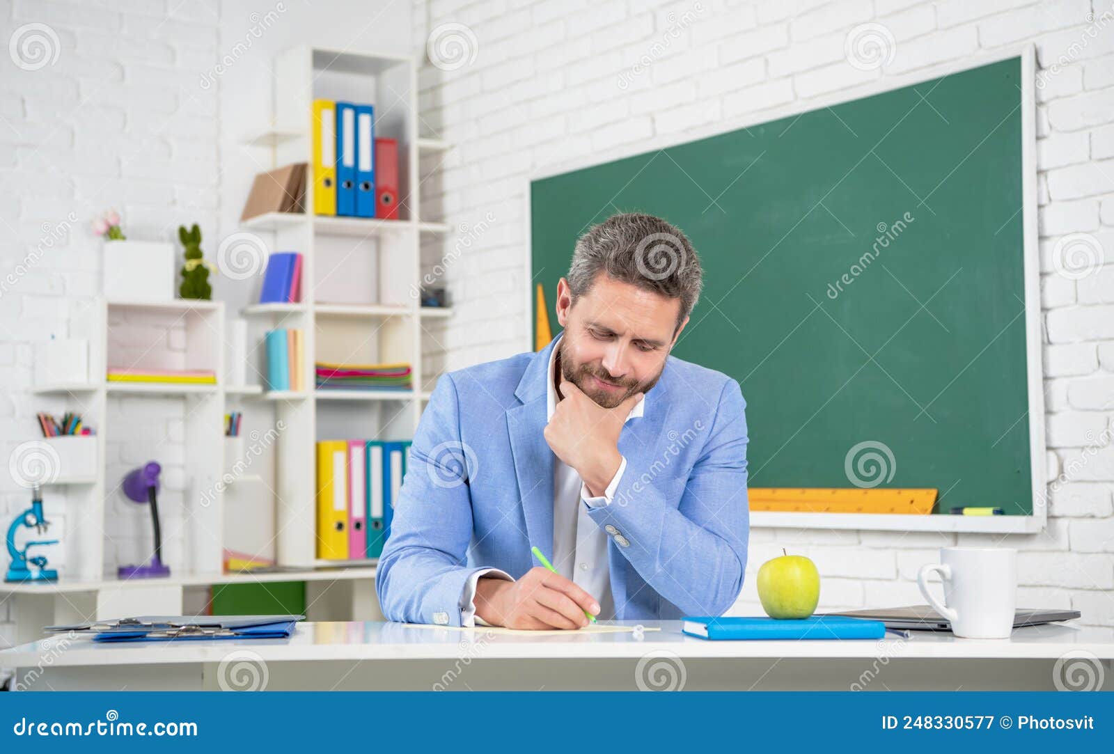Positive School Teacher in Classroom at Blackboard Stock Image Image