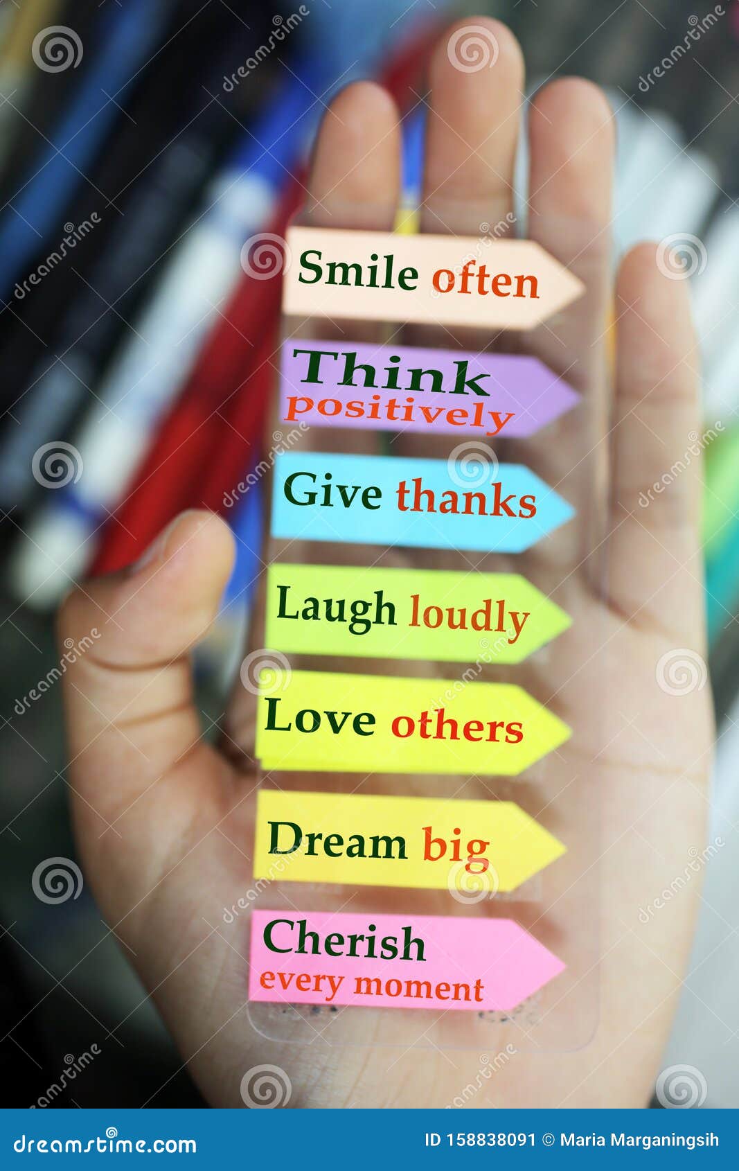 positive words in hand. todays goals list. morning inspirational words - smile often. think positively. give thanks. laugh loudly