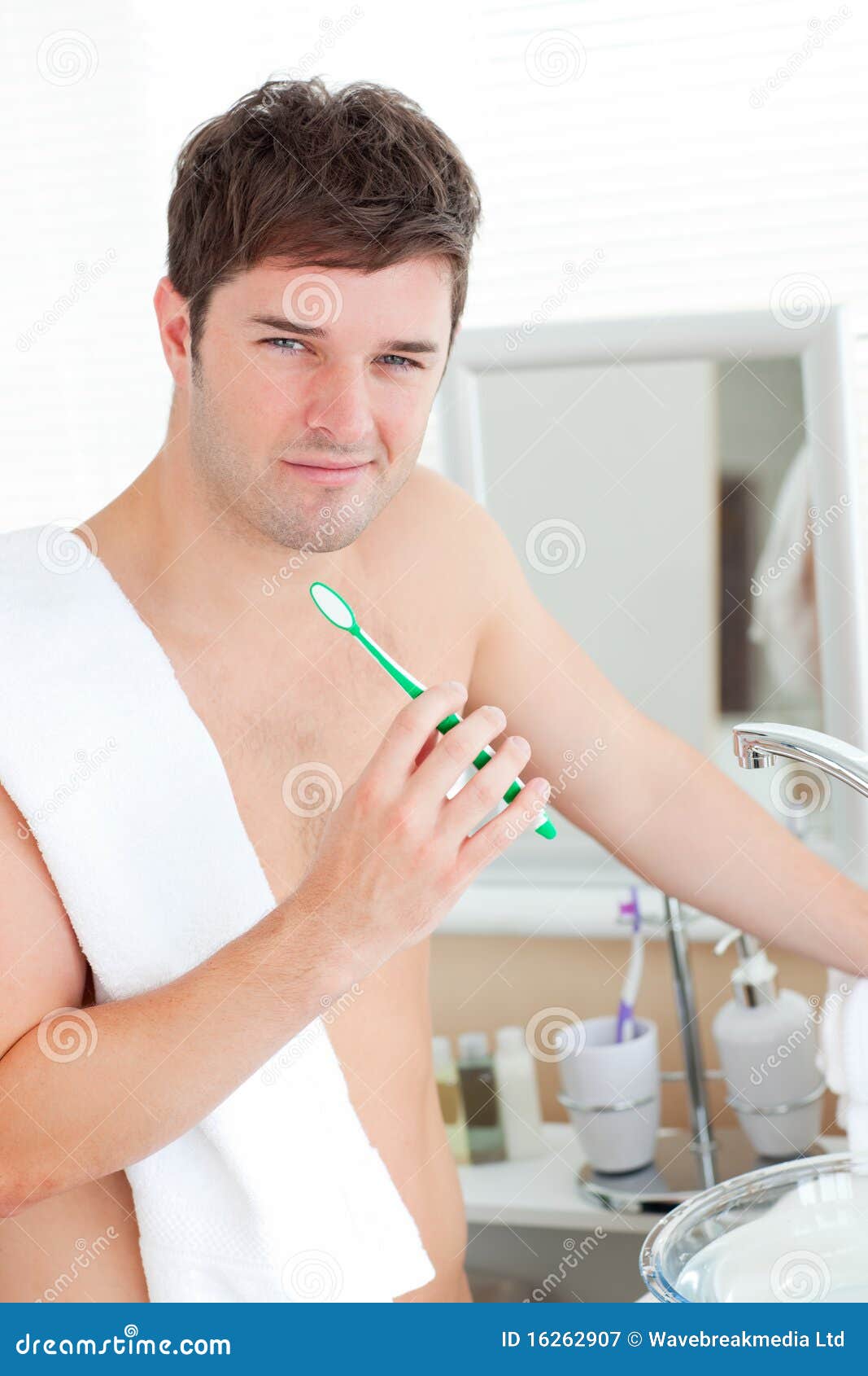 Positive Young Man with a Towel Brushing His Teeth Stock Image Image