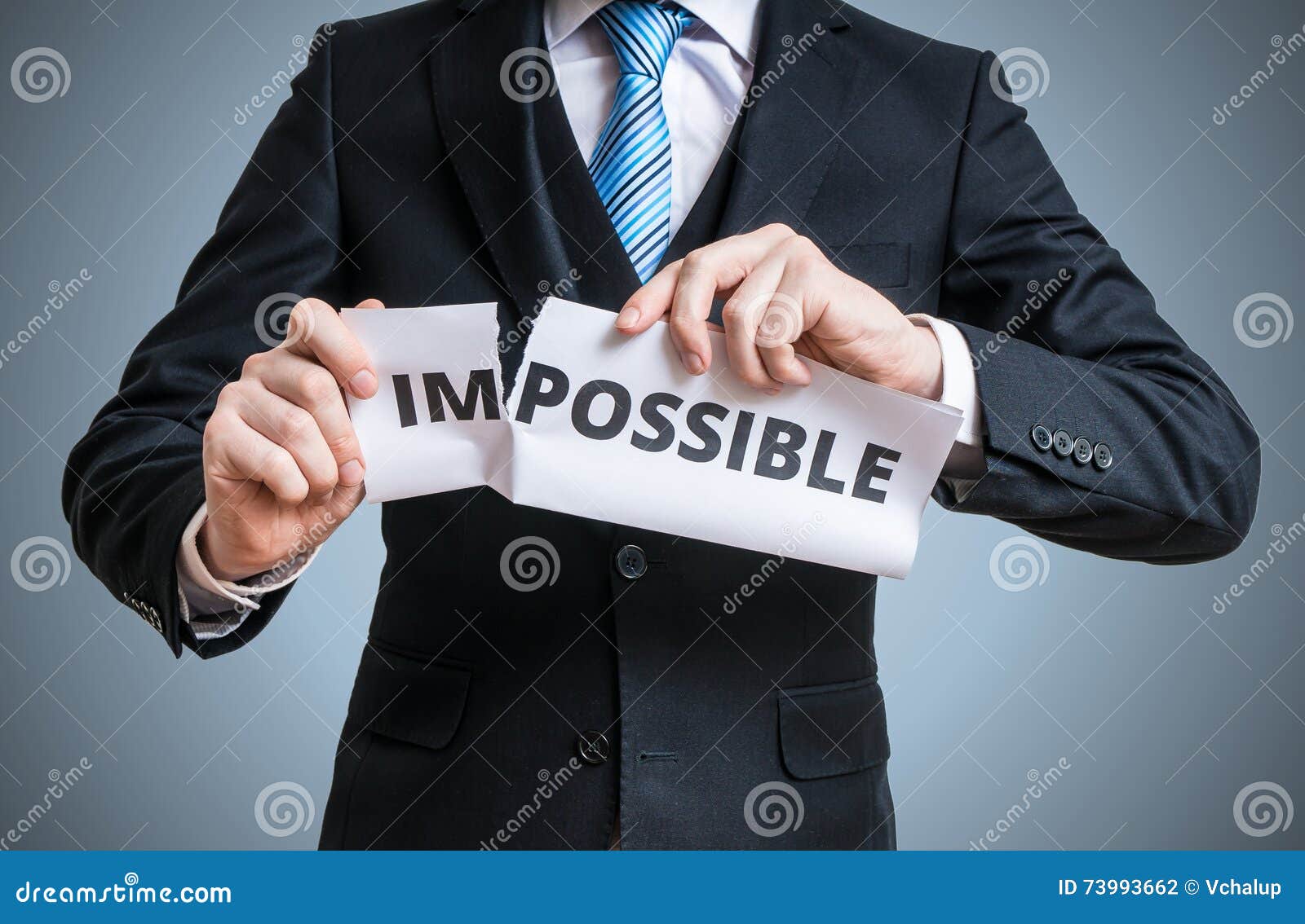 possibility concept. man is tearing paper with impossible word