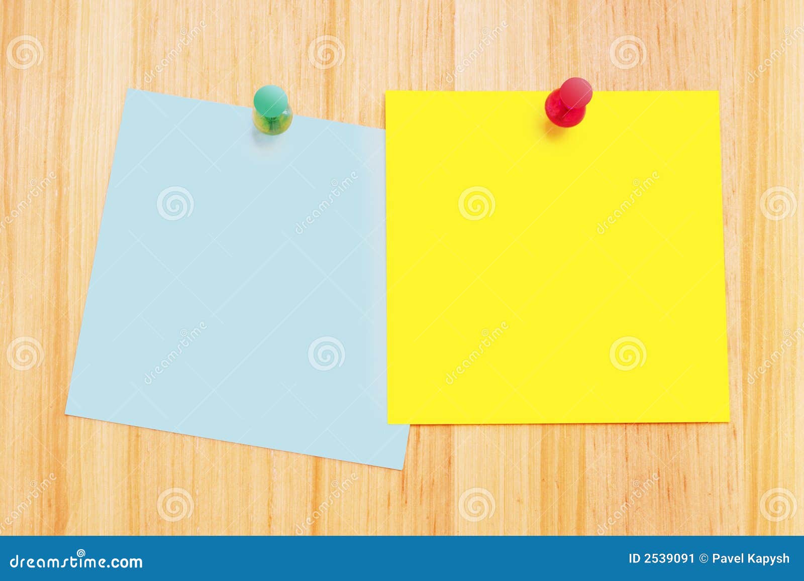 Pair of clean post-it notes on a wood background with push pins.