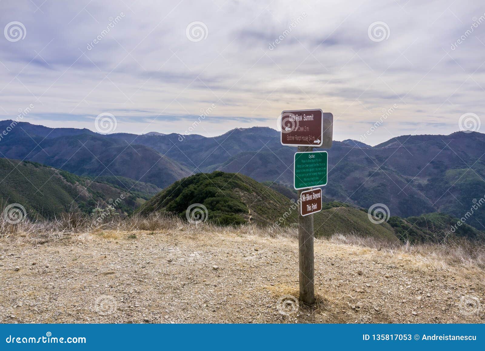 posted signs showing distances and directions and other notices in montana de oro state park placed on oats peak, one of the
