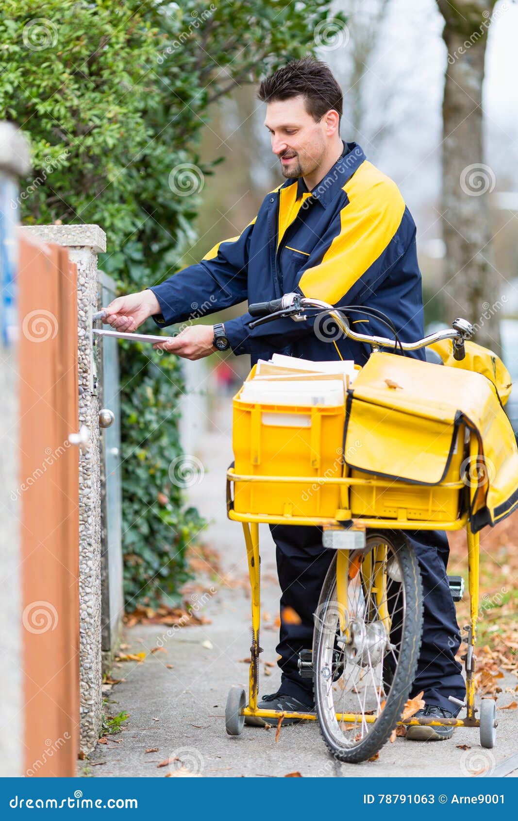 Postman Delivering Letters To Mailbox of Recipient Stock Image Image