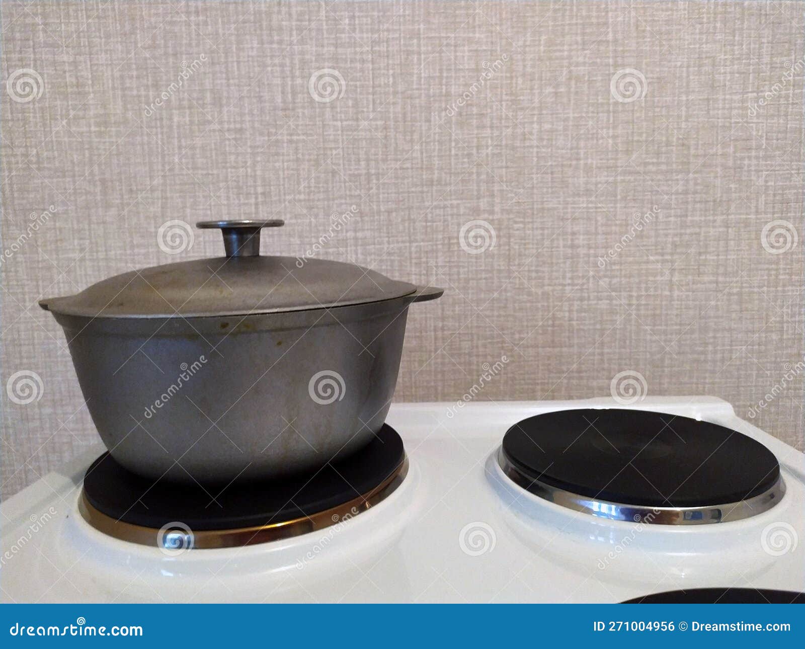 A Pot in the Kitchen on an Electric Stove. Cooking. Stock Photo Image