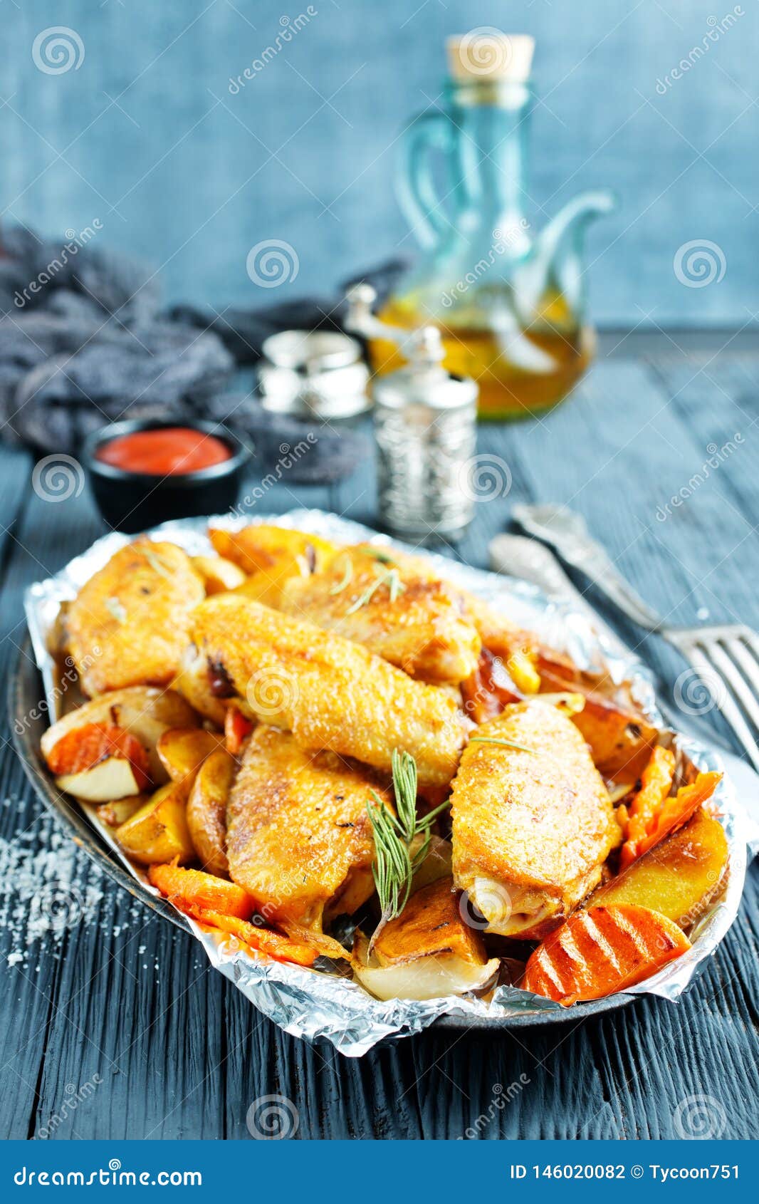 Potato with chicken wings stock photo. Image of grilled 146020082