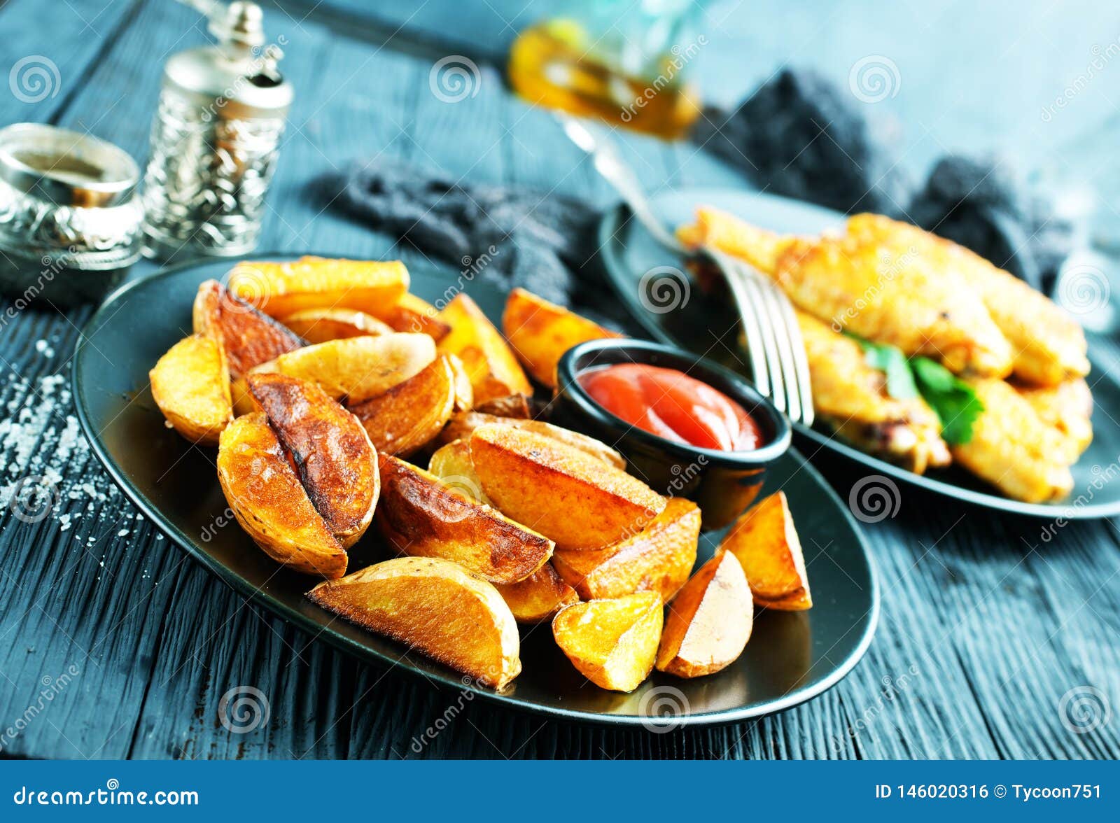 Potato with chicken wings stock photo. Image of plate 146020316