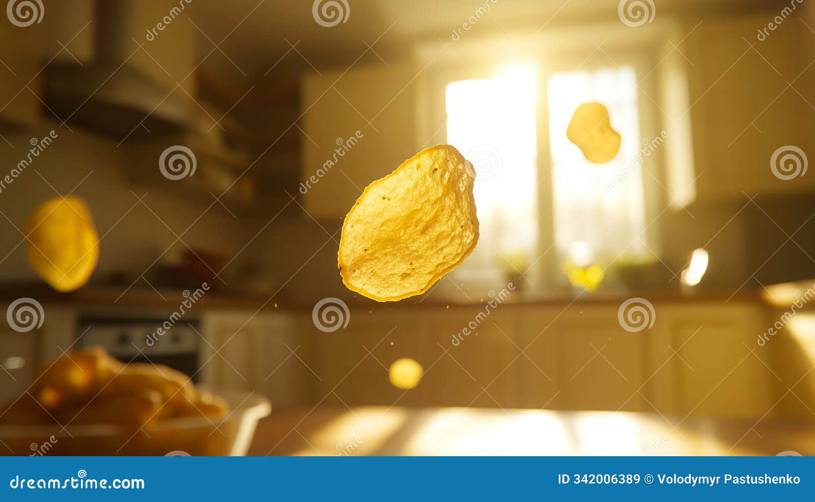 a potato chip flying through the air over a kitchen counter