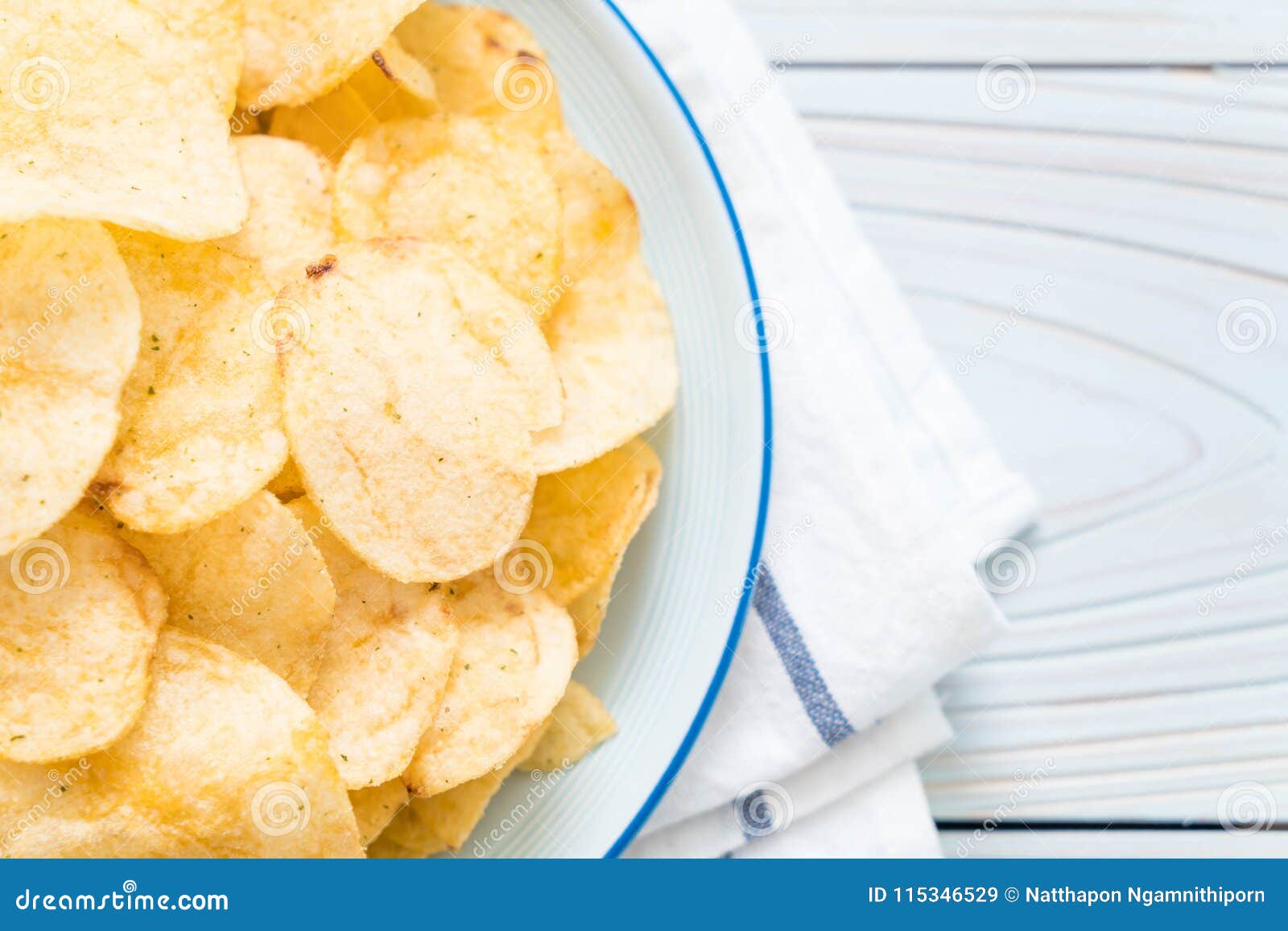Potato chips on plate stock image. Image of unhealthy 115346529