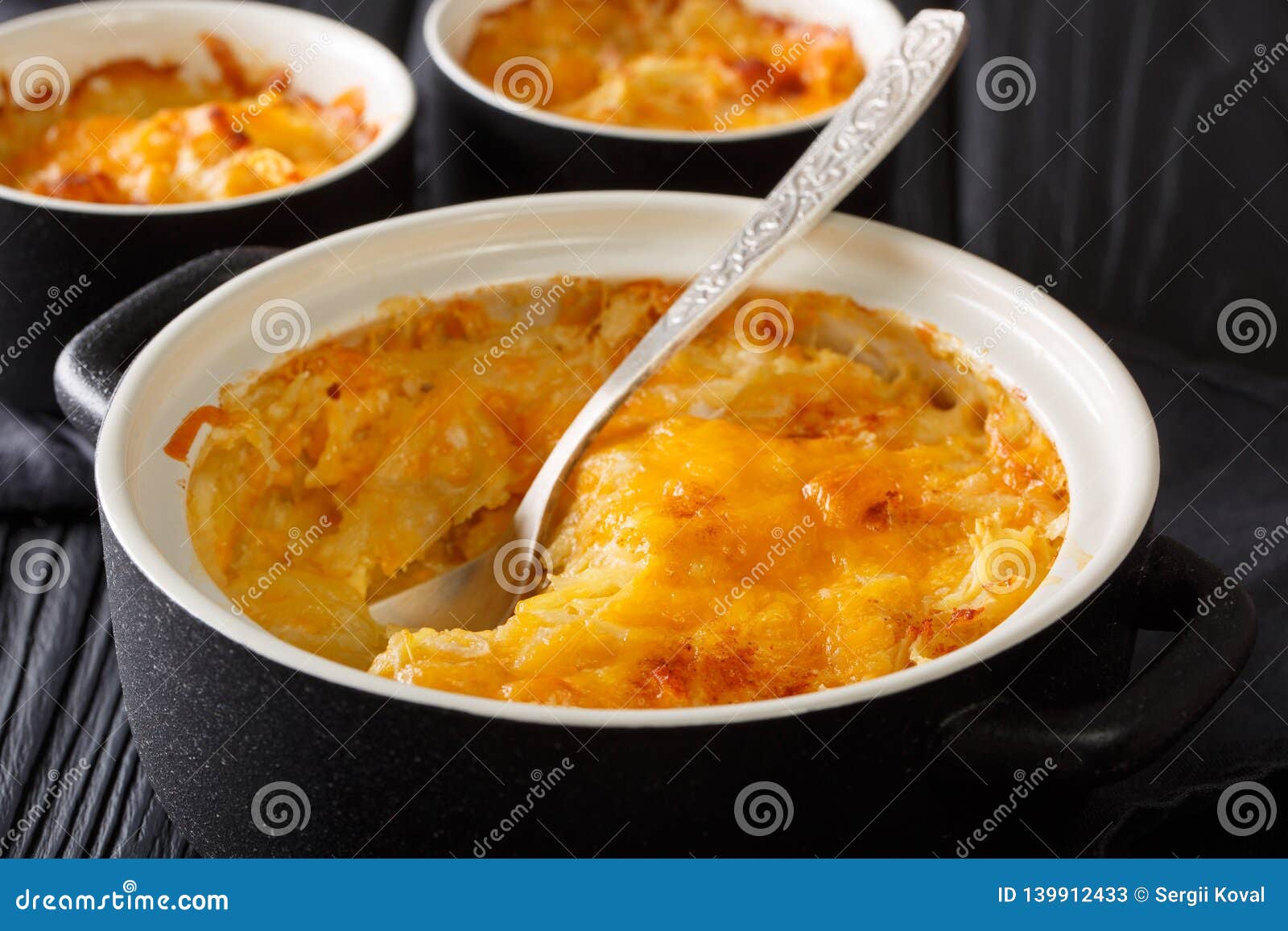 Potato Gratin Baked with Sour Cream, Onions and Cheddar Cheese Closeup