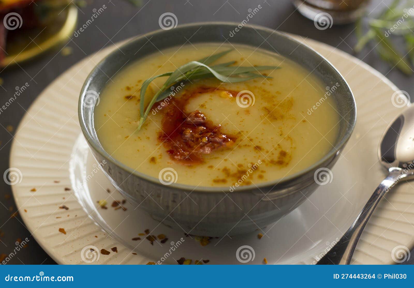 Potato and Leek Soup with Pepper Compote and Tarragon Stock Photo