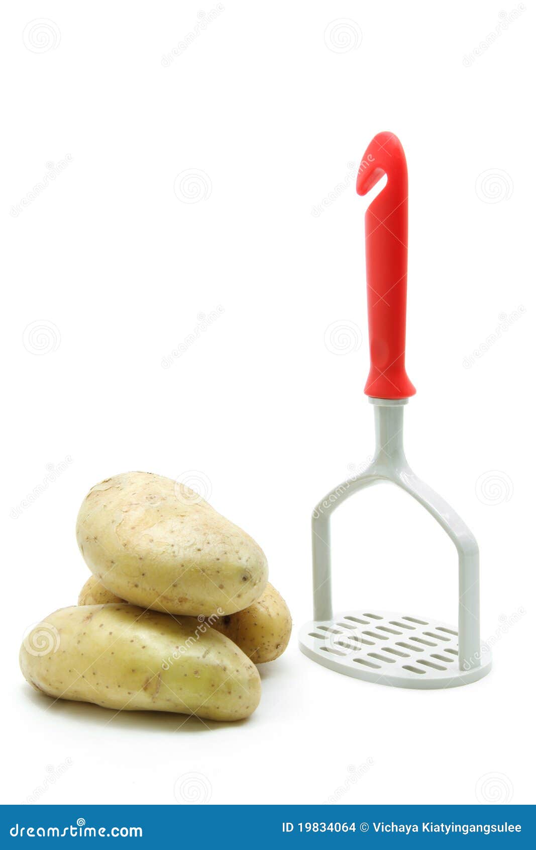 Potato with masher stock photo. Image of mashed, kitchenware 19834064