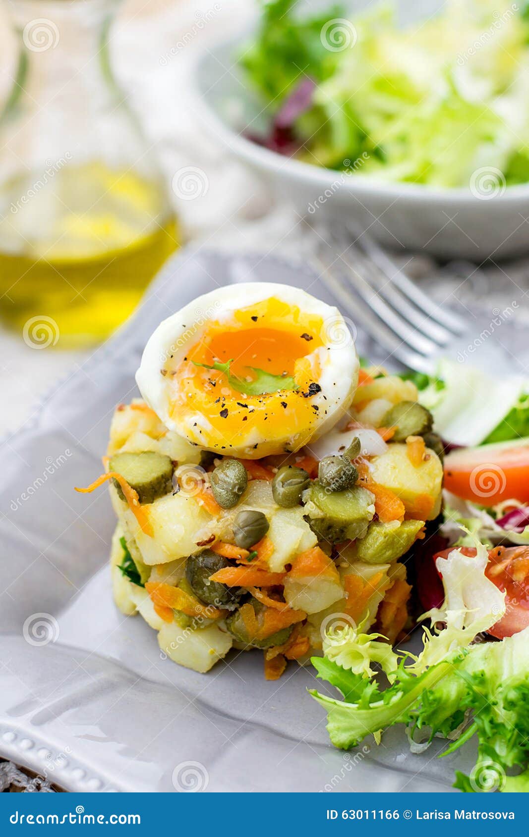 Potato Salad with Pickles, Carrots and Softboiled Egg Stock Photo
