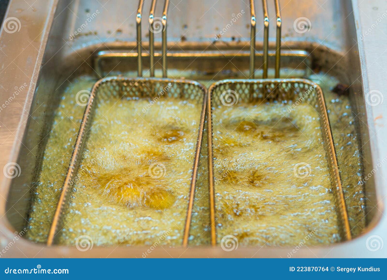 The Potatoes are Fried in Boiling Oil Stock Photo Image of boiling