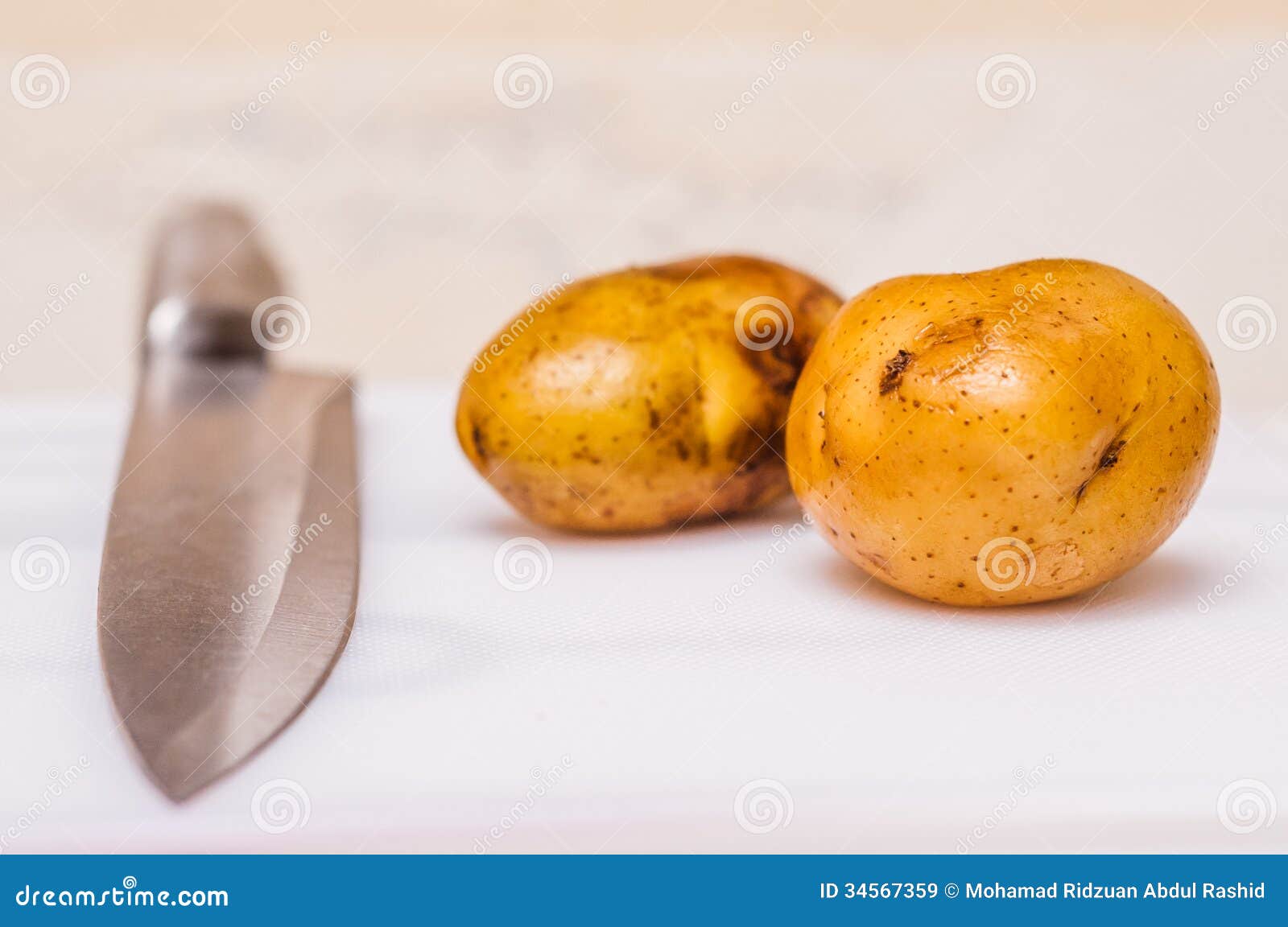 Potatoes and Knife on Cutting Board Stock Image Image of knife