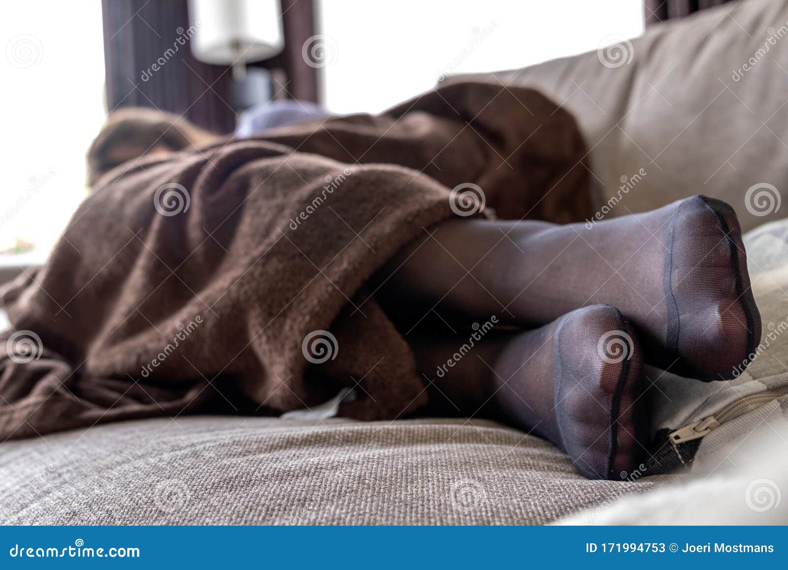 A Potrait of a Girls Black Pantyhose Feet while she is Sleeping in the  Couch Under a Brown Cosy Blanket Stock Image - Image of close, feet:  171994753