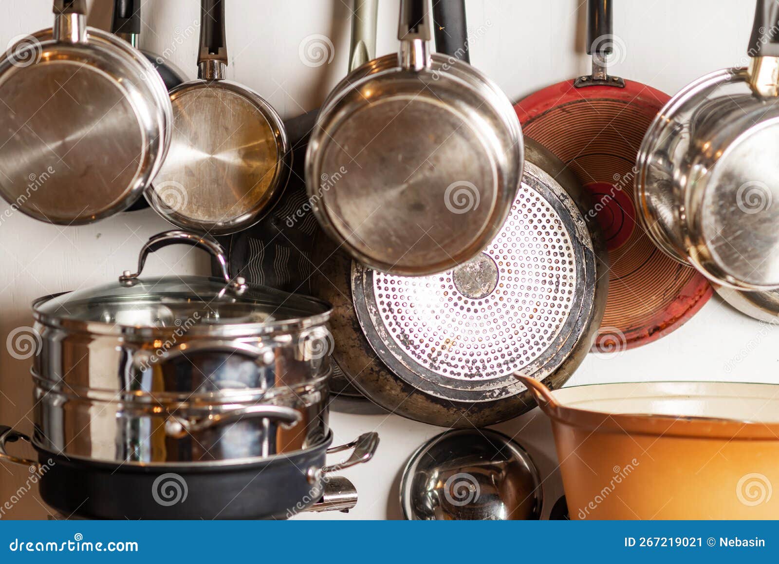 Pots and Pans Hang in the Kitchen. Kitchen Utensils, Home Interior