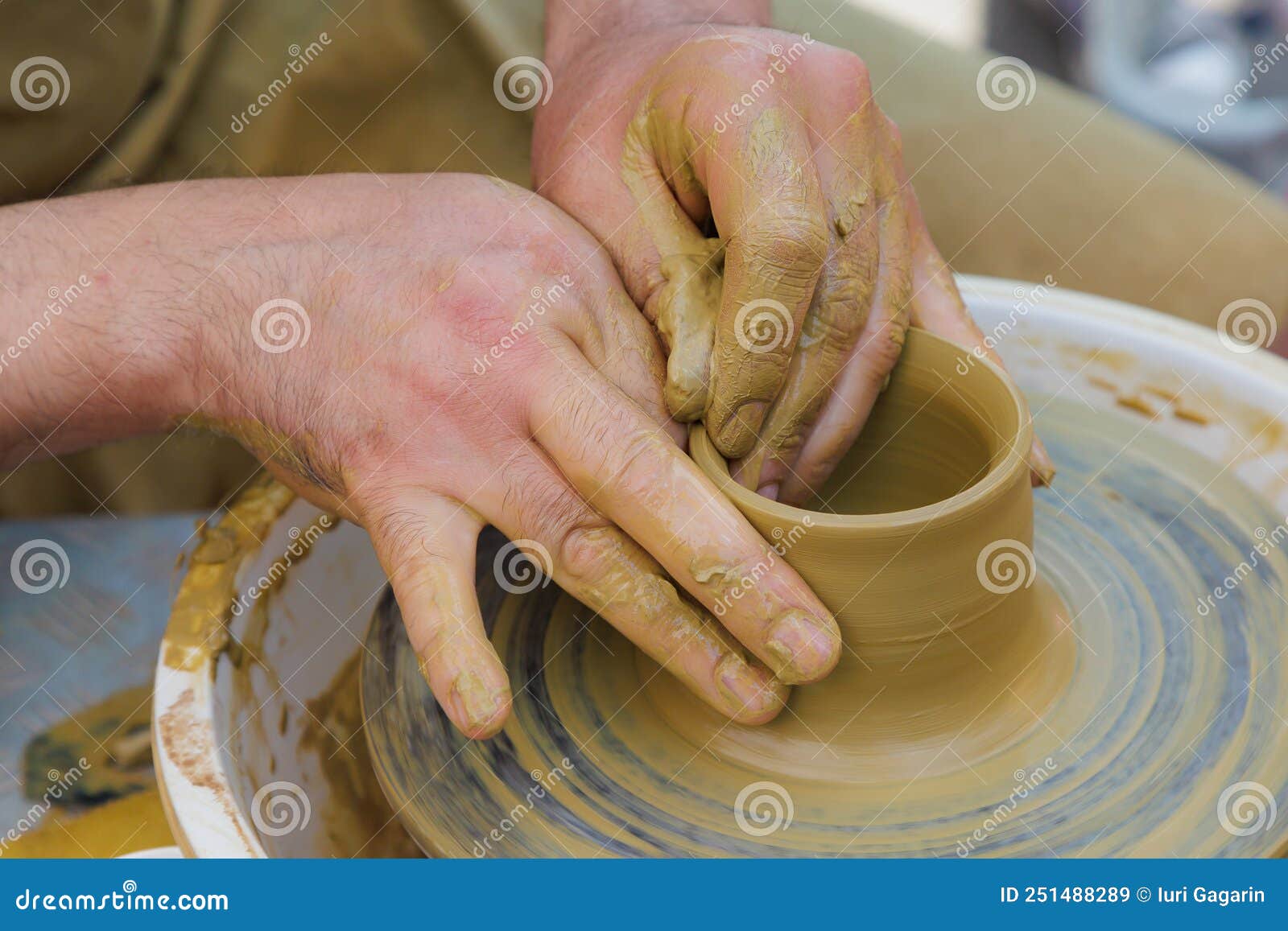 Potter in the Process of Working on a Potters Wheel. Closeup Hands