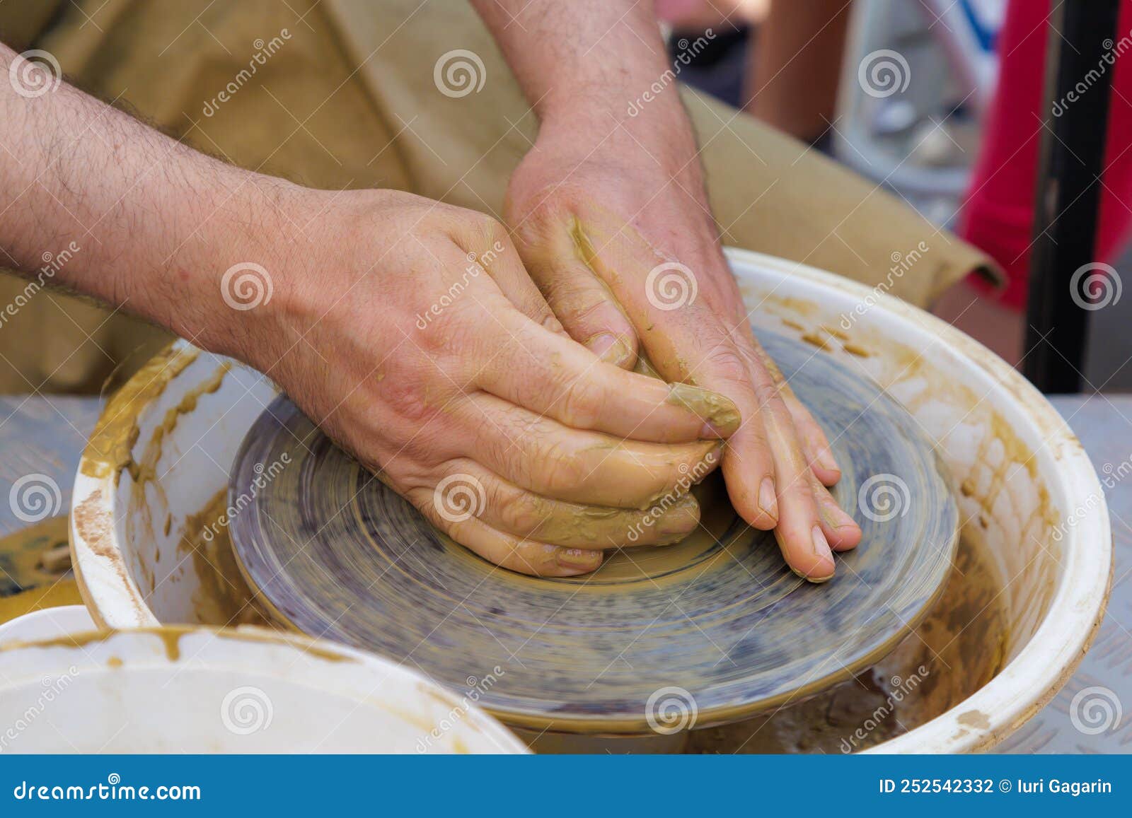 Potter in the Process of Working on a Potters Wheel. Closeup Hands