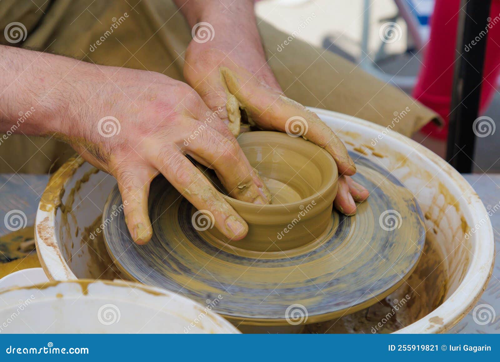 Potter in the Process of Working on a Potters Wheel. Closeup Hands
