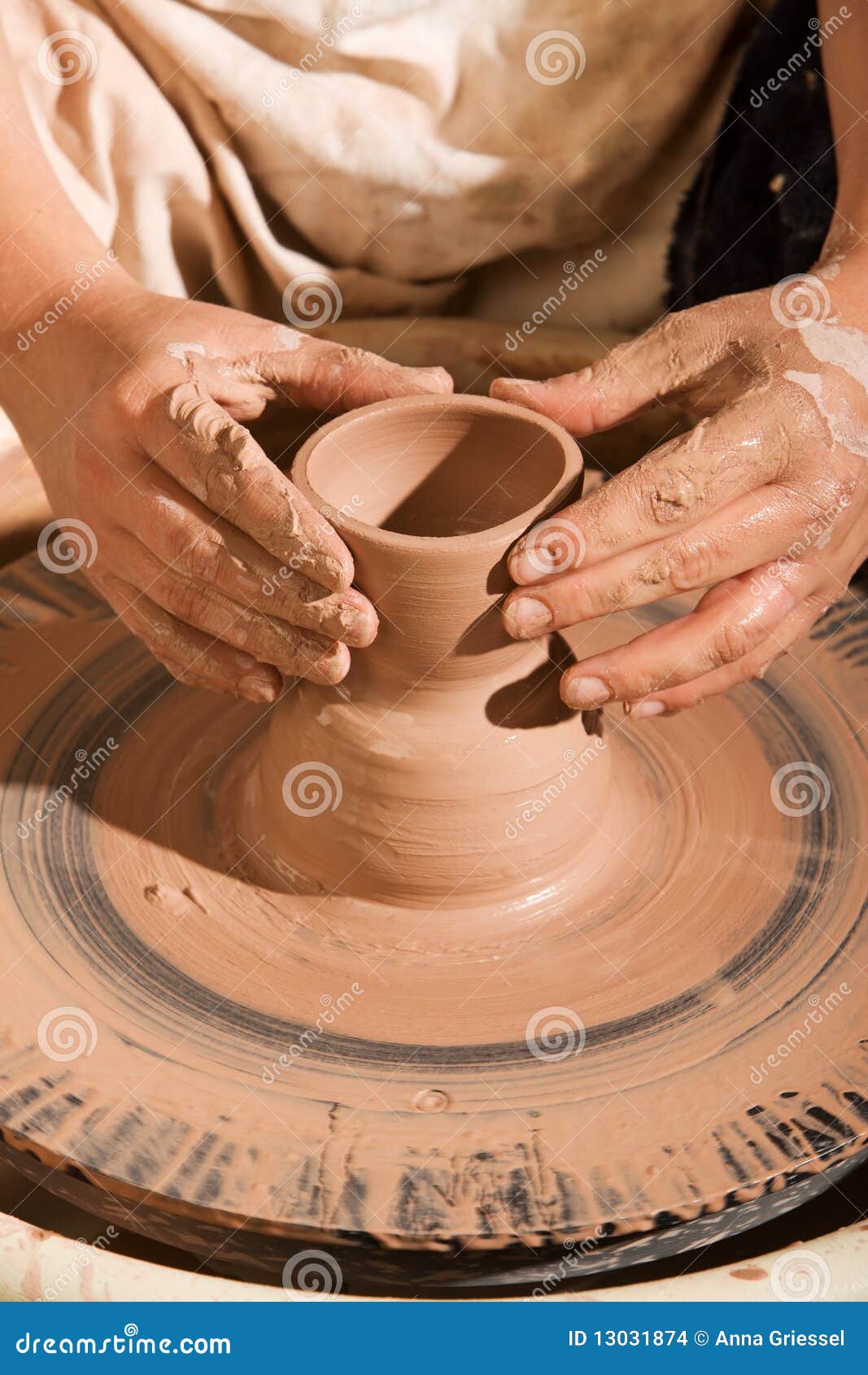 potter shaping clay