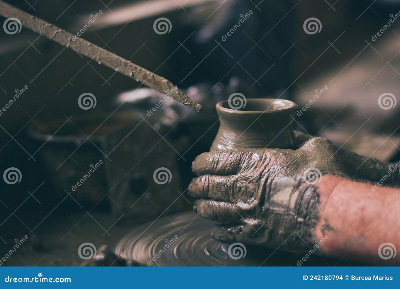 Potters Hands are Creating Earthenware on Potters Wheel. Concept of