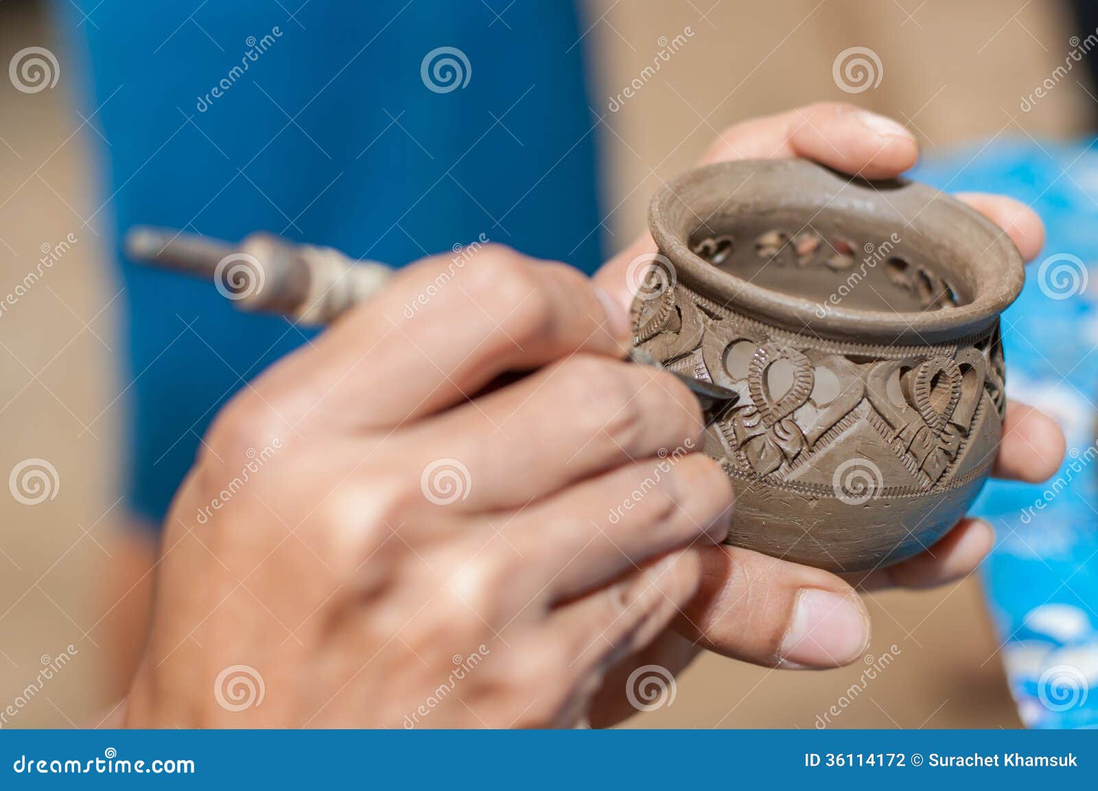 Pottery carving in hand stock photo. Image of craft, decorating 36114172