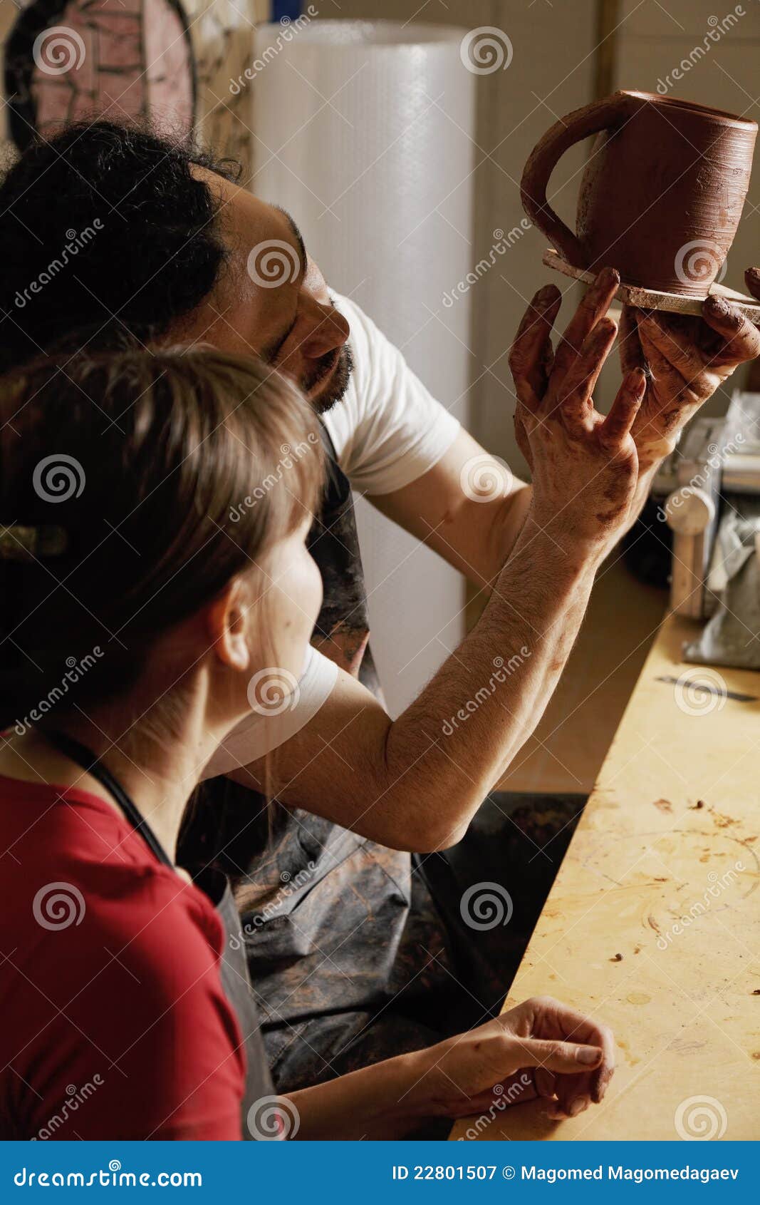 Pottery Teacher Showing Student the Jug Stock Image Image of