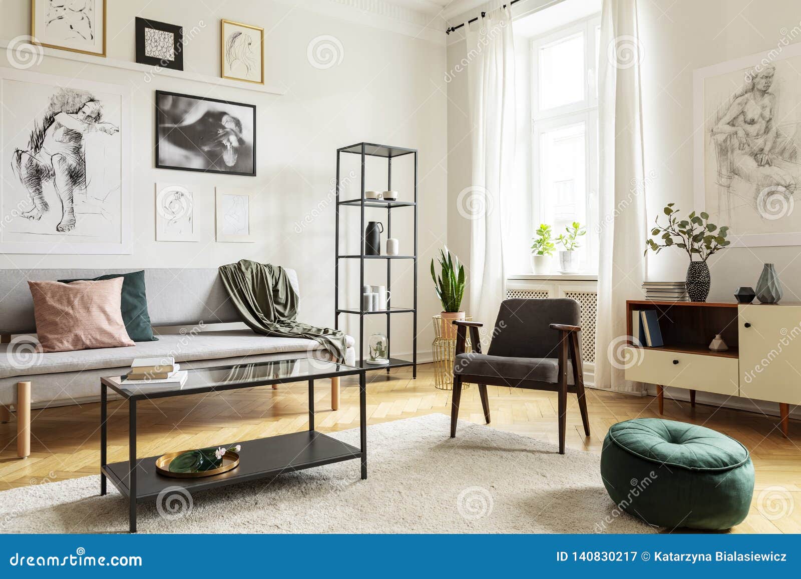 Pouf Next To Armchair In Living Room Interior With Table 