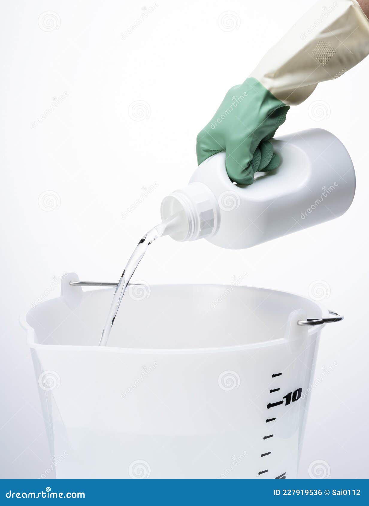 Pour the Detergent into the Bucket Stock Photo Image of household