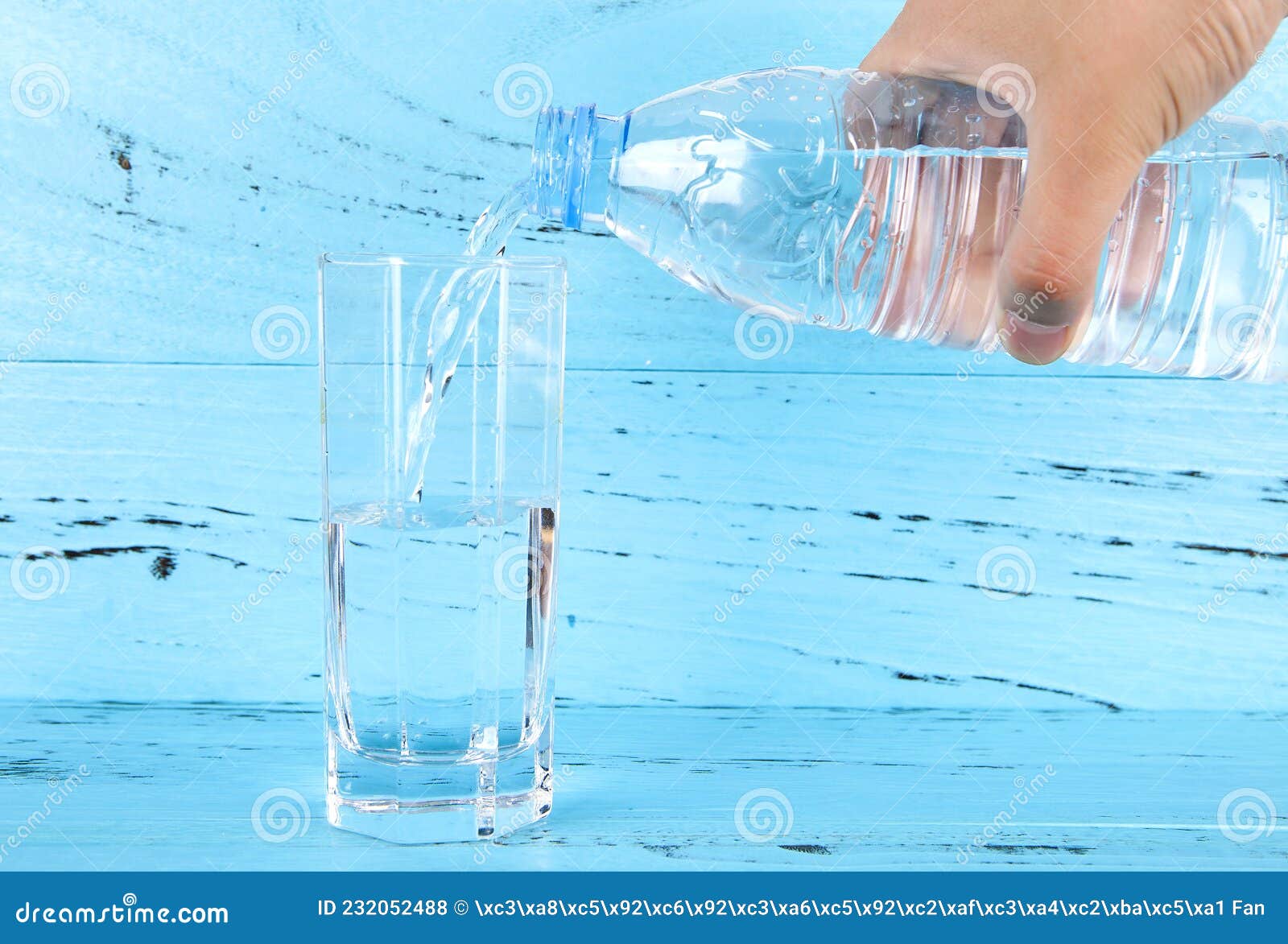 Pour water into the glass stock photo. Image of indoor 232052488