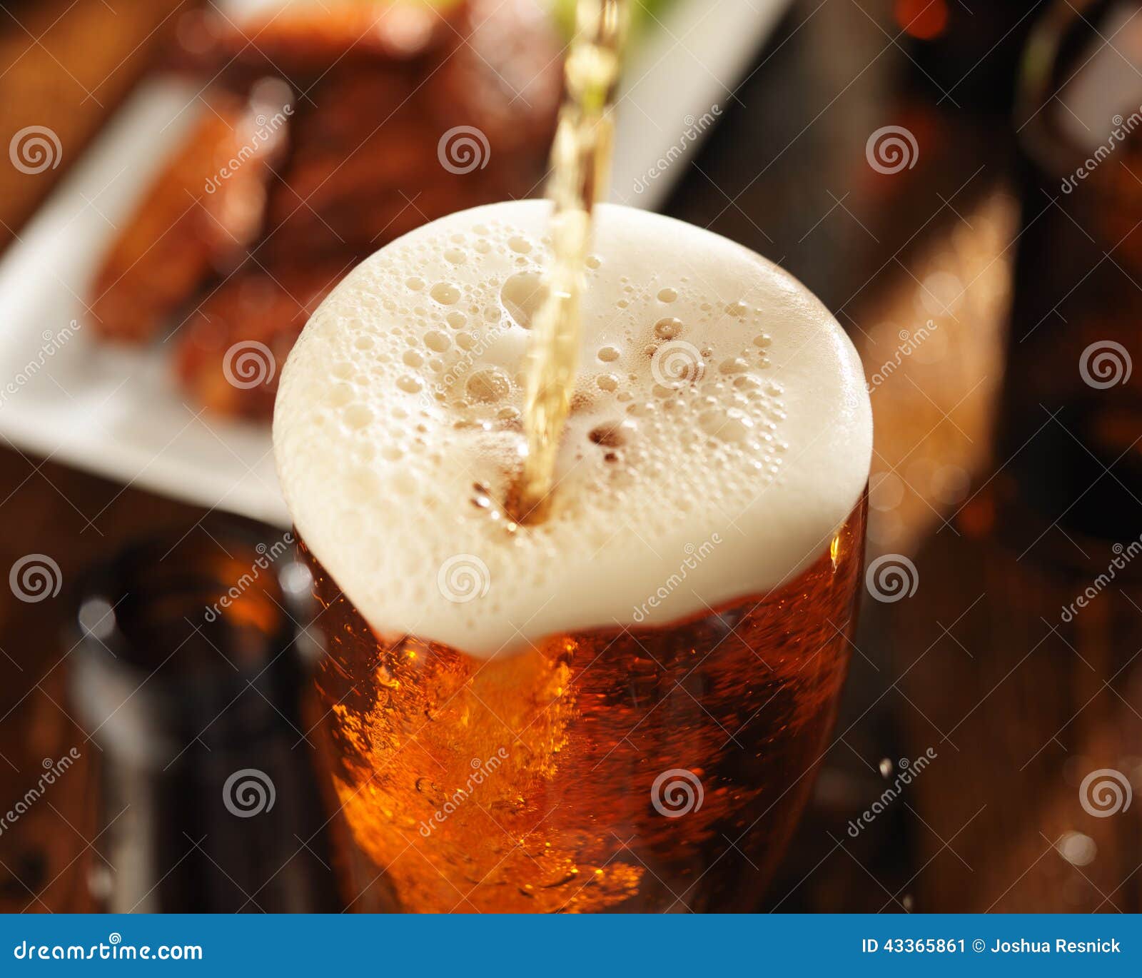 pouring beer into glass