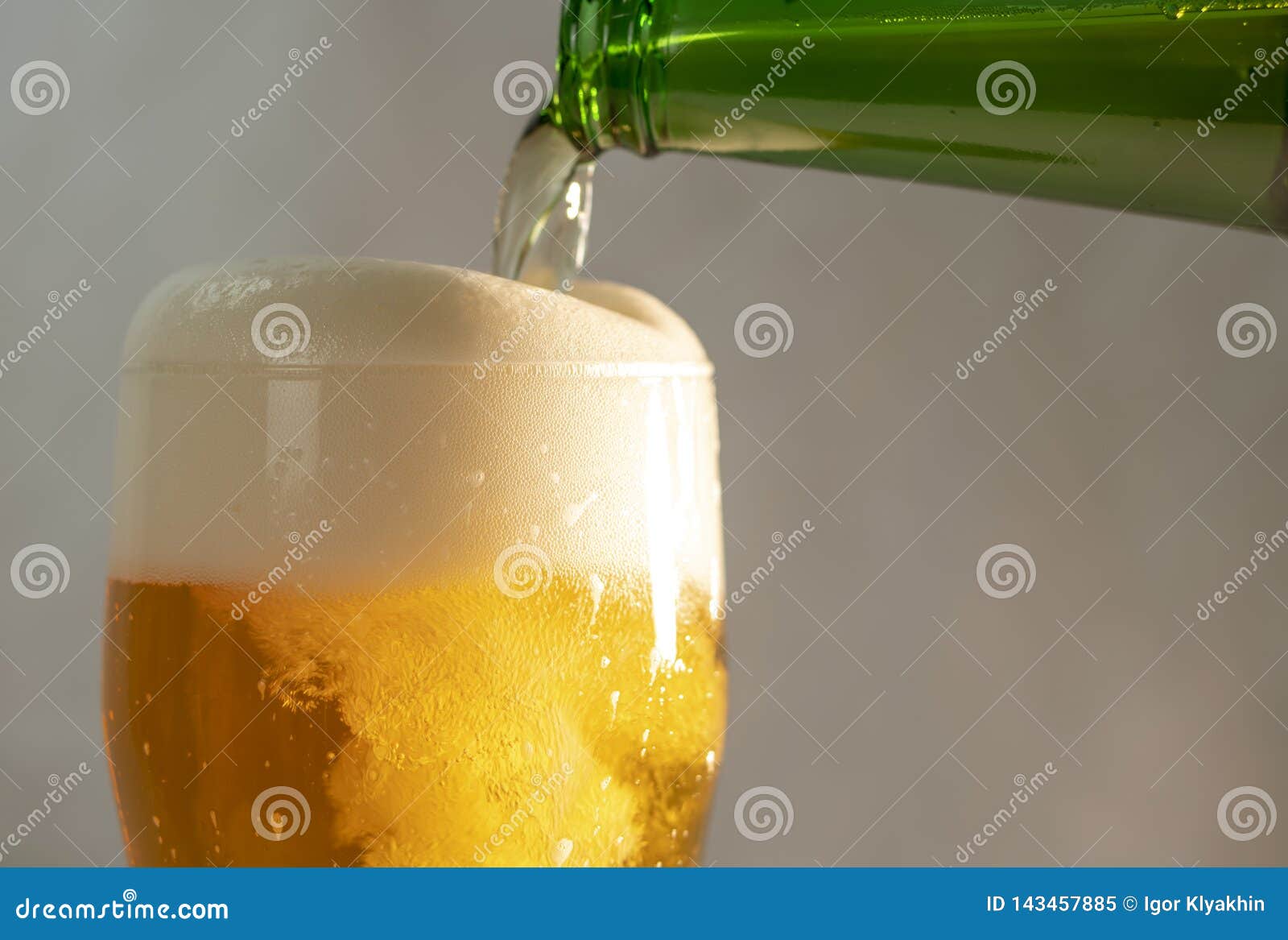 Pouring Beer into a Glass from a Bottle Stock Image Image of orange