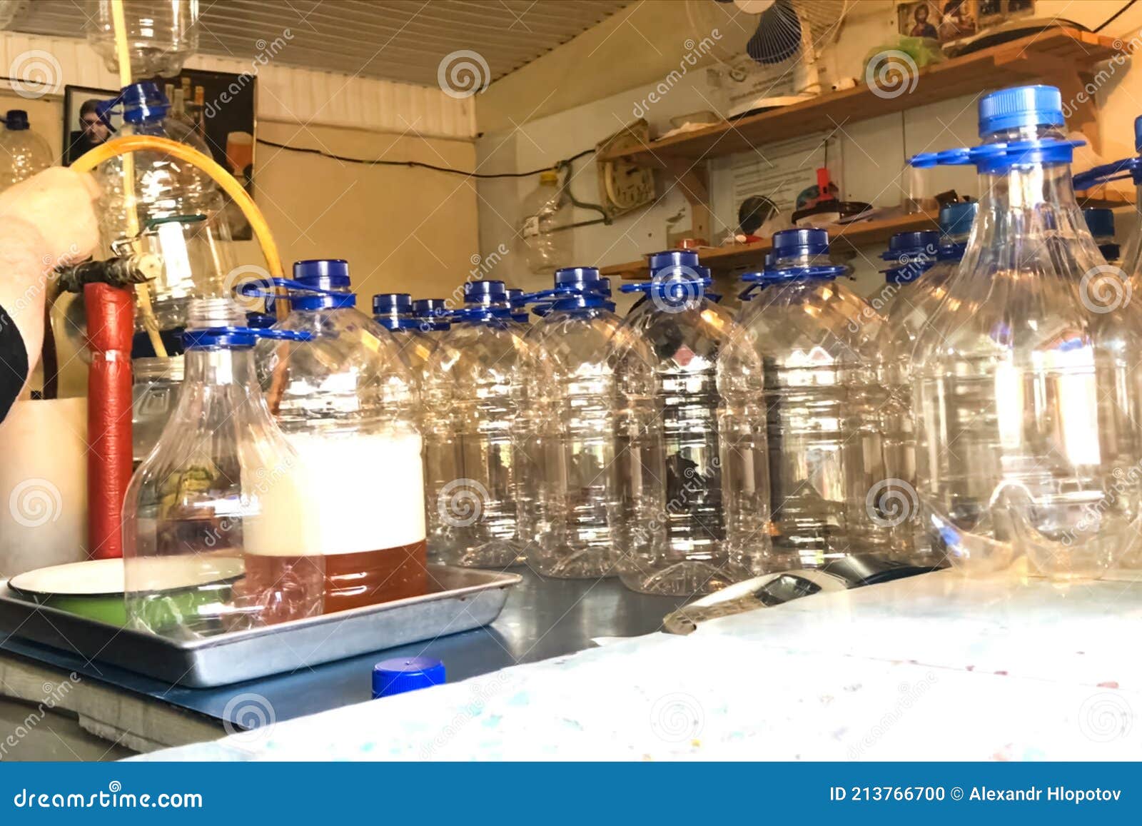Pouring Beer into Plastic Bottles Stock Photo Image of yellow, shrink