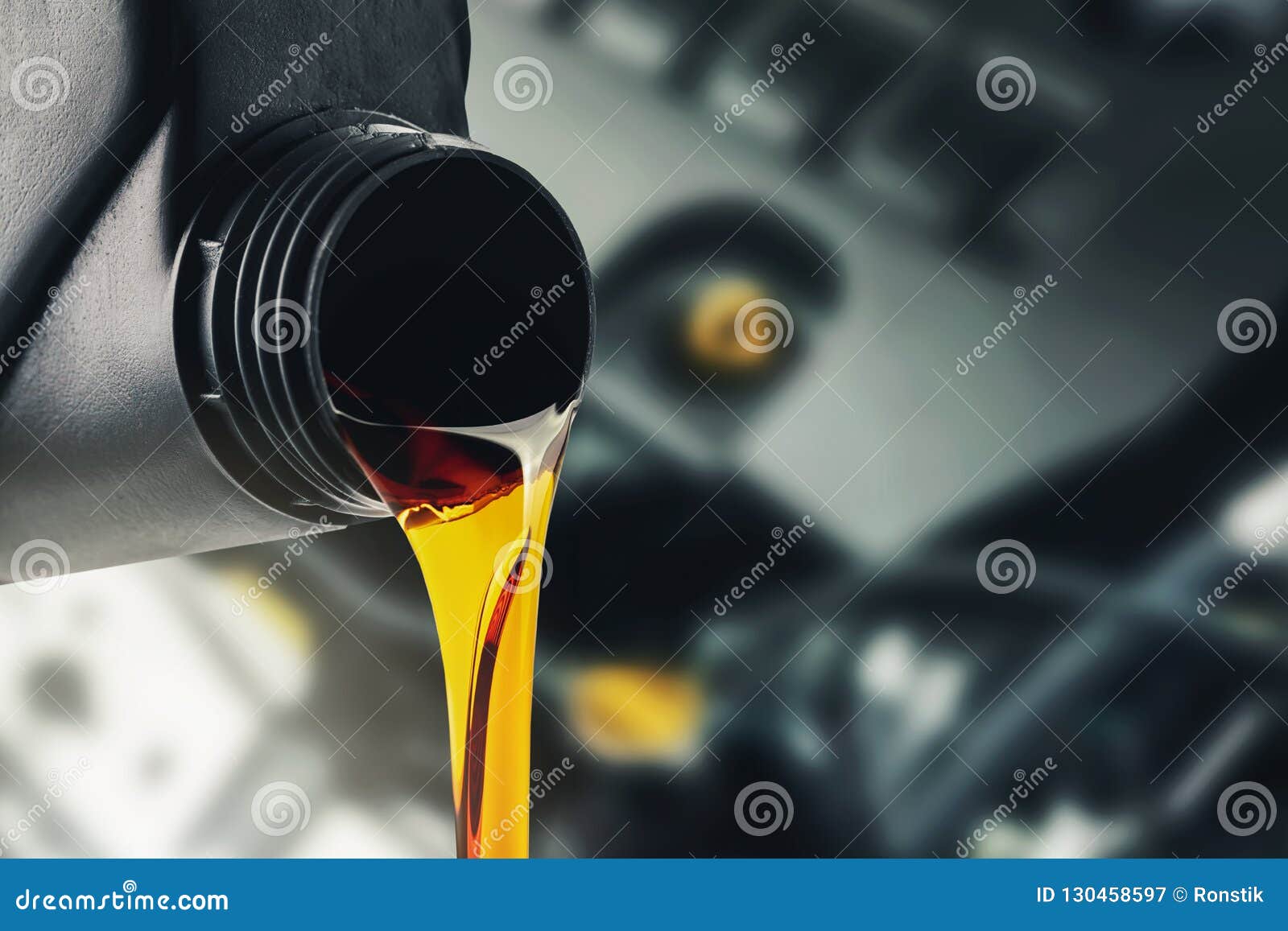 pouring changing car engine oil
