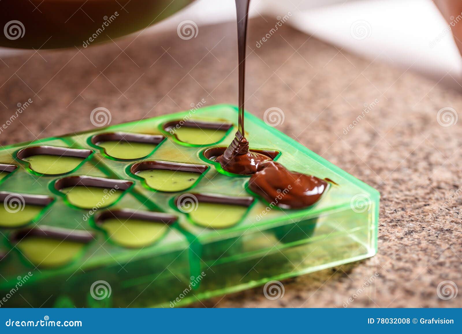 Pouring chocolate in mold stock photo. Image of shaped 78032008