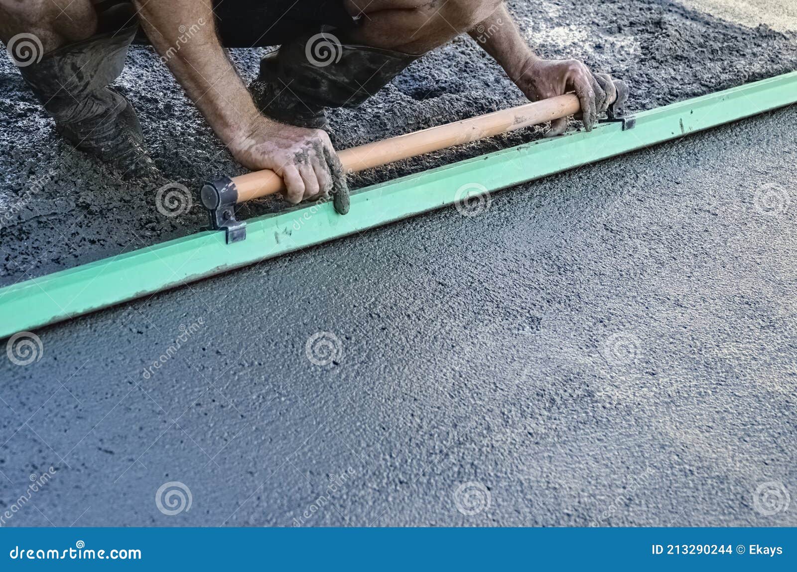 Pouring of Concrete for a Driveway Man Using Float Stock Photo Image