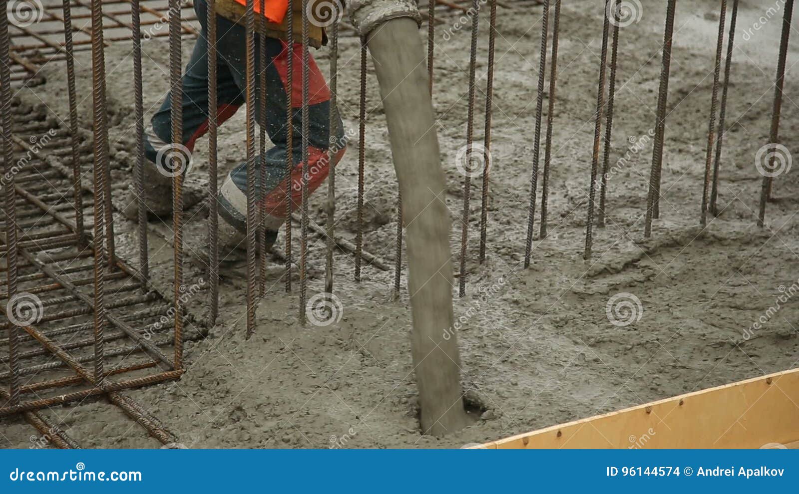 Pouring Concrete Mix From Cement Mixer On Concreting Formwork