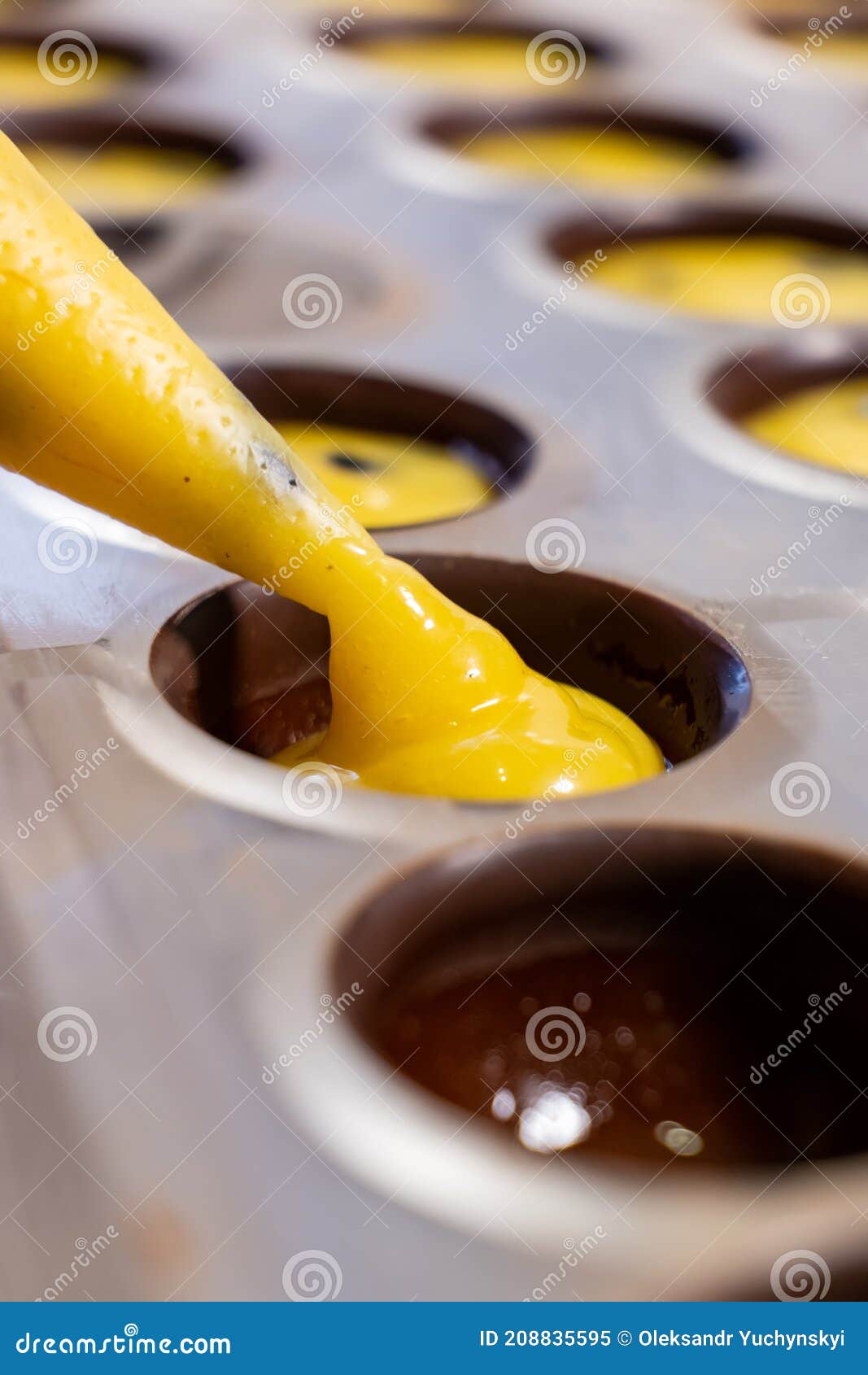 Pouring the Filling into Candies during the Manufacturing Process Stock