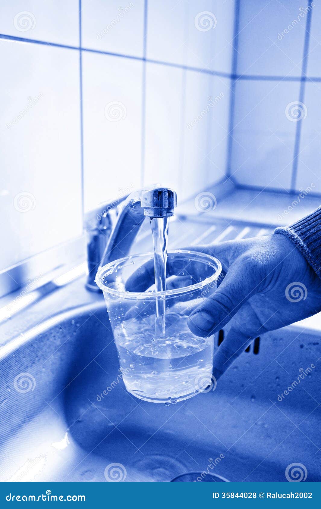 Pouring fresh Tap Water stock photo. Image of bathroom 35844028