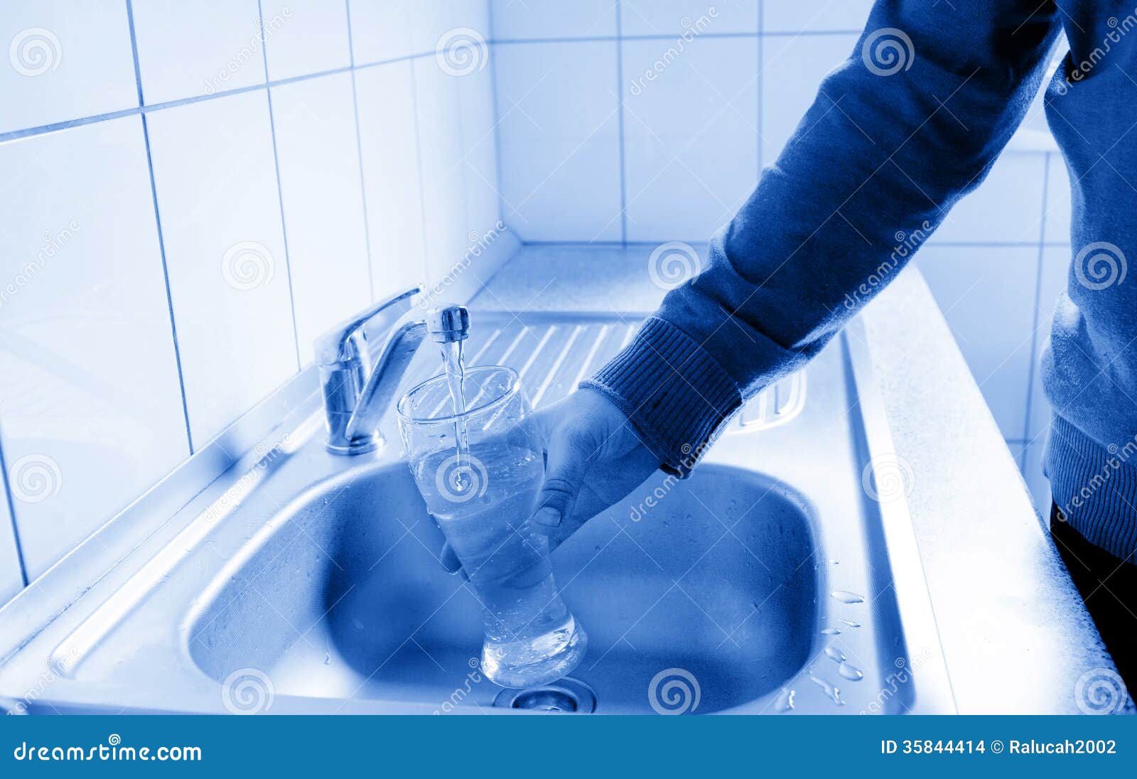 Pouring fresh Tap Water stock photo. Image of fresh, cool 35844414
